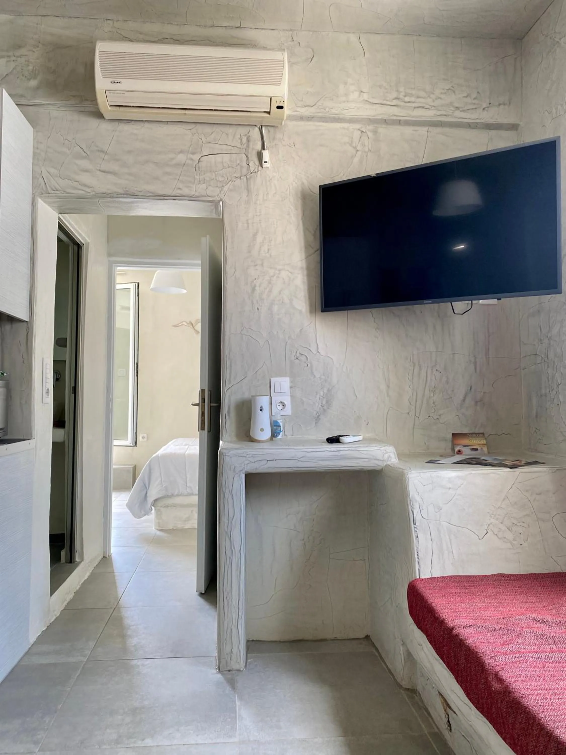 Photo of the whole room, Bed in The Muses of Santorini Private Jacuzzi Suites