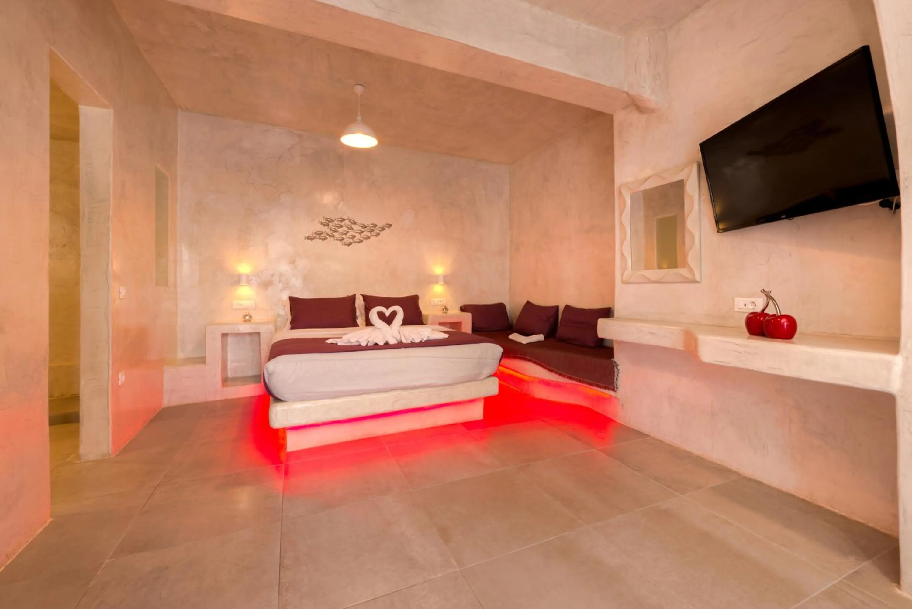 Photo of the whole room, Bed in The Muses of Santorini Private Jacuzzi Suites