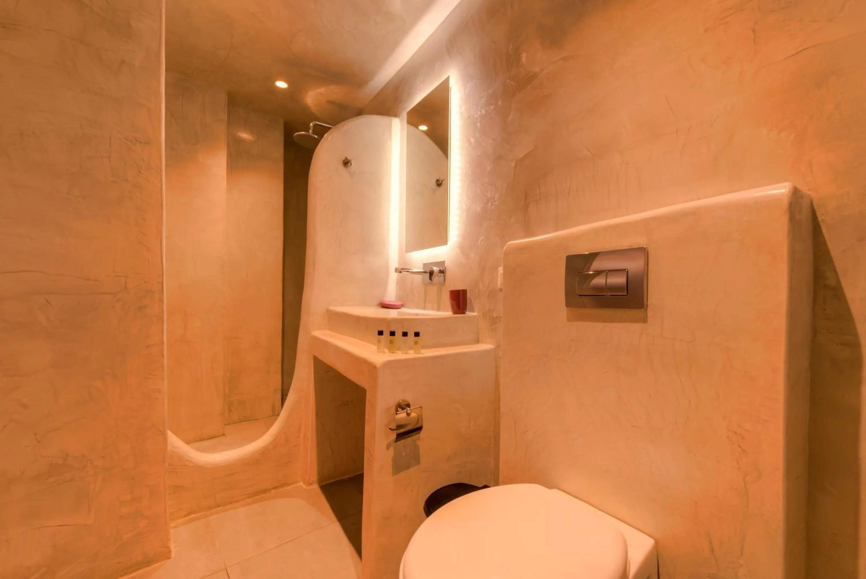 Bathroom in The Muses of Santorini Private Jacuzzi Suites