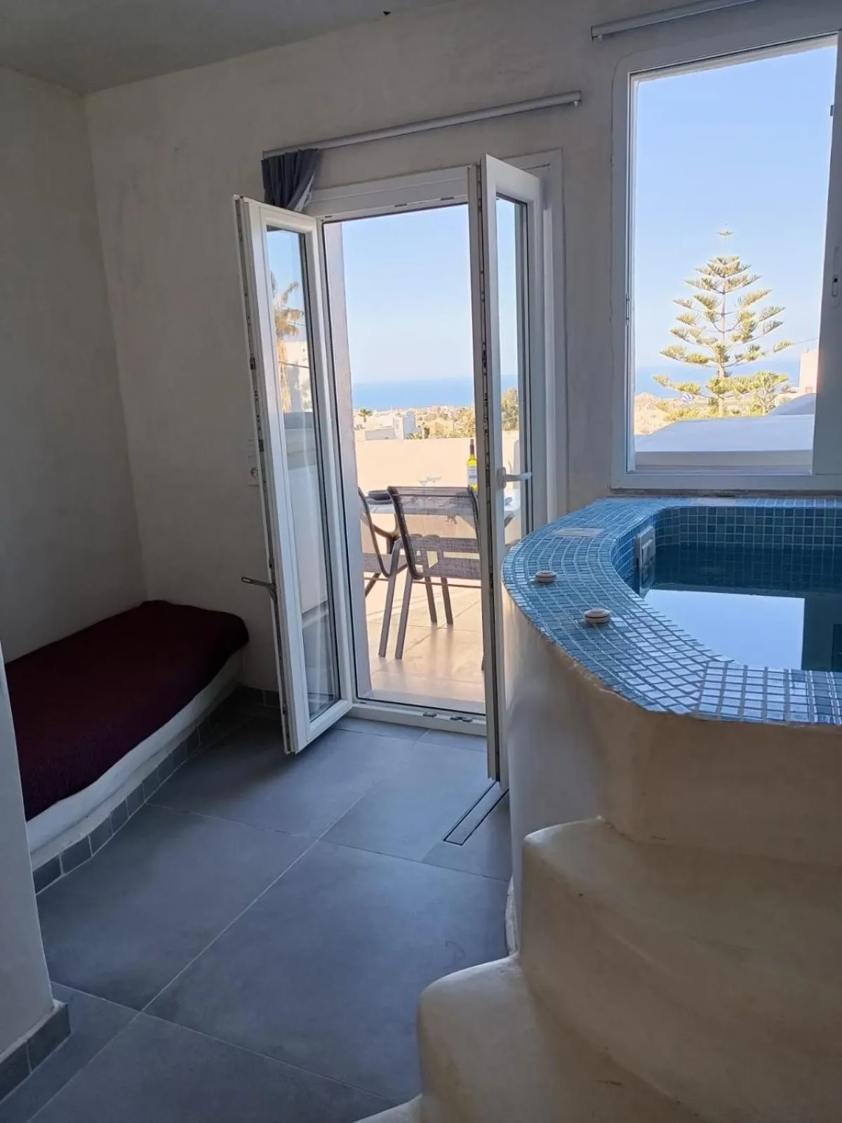 Photo of the whole room, Bed in The Muses of Santorini Private Jacuzzi Suites