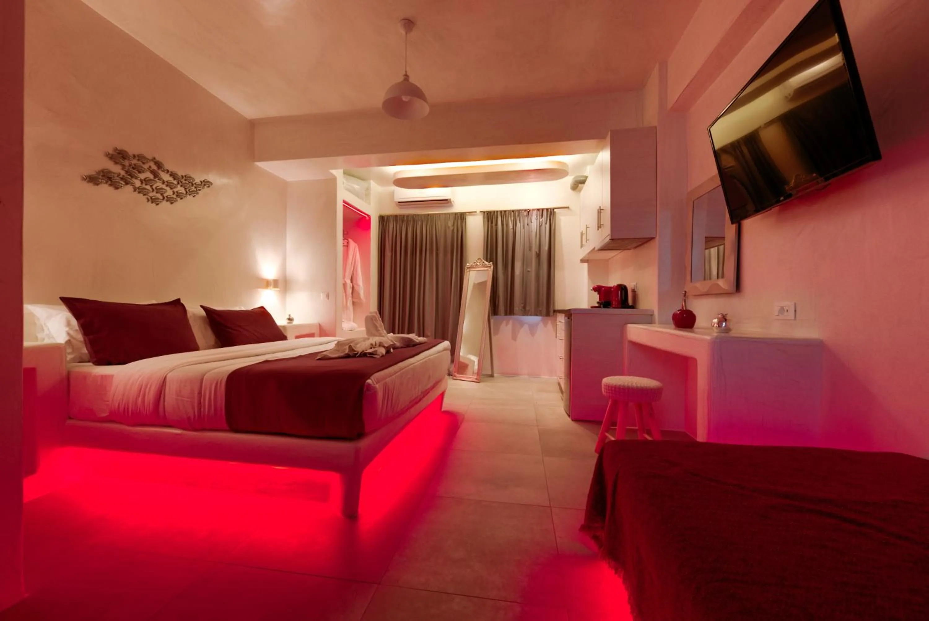 Photo of the whole room, Bed in The Muses of Santorini Private Jacuzzi Suites