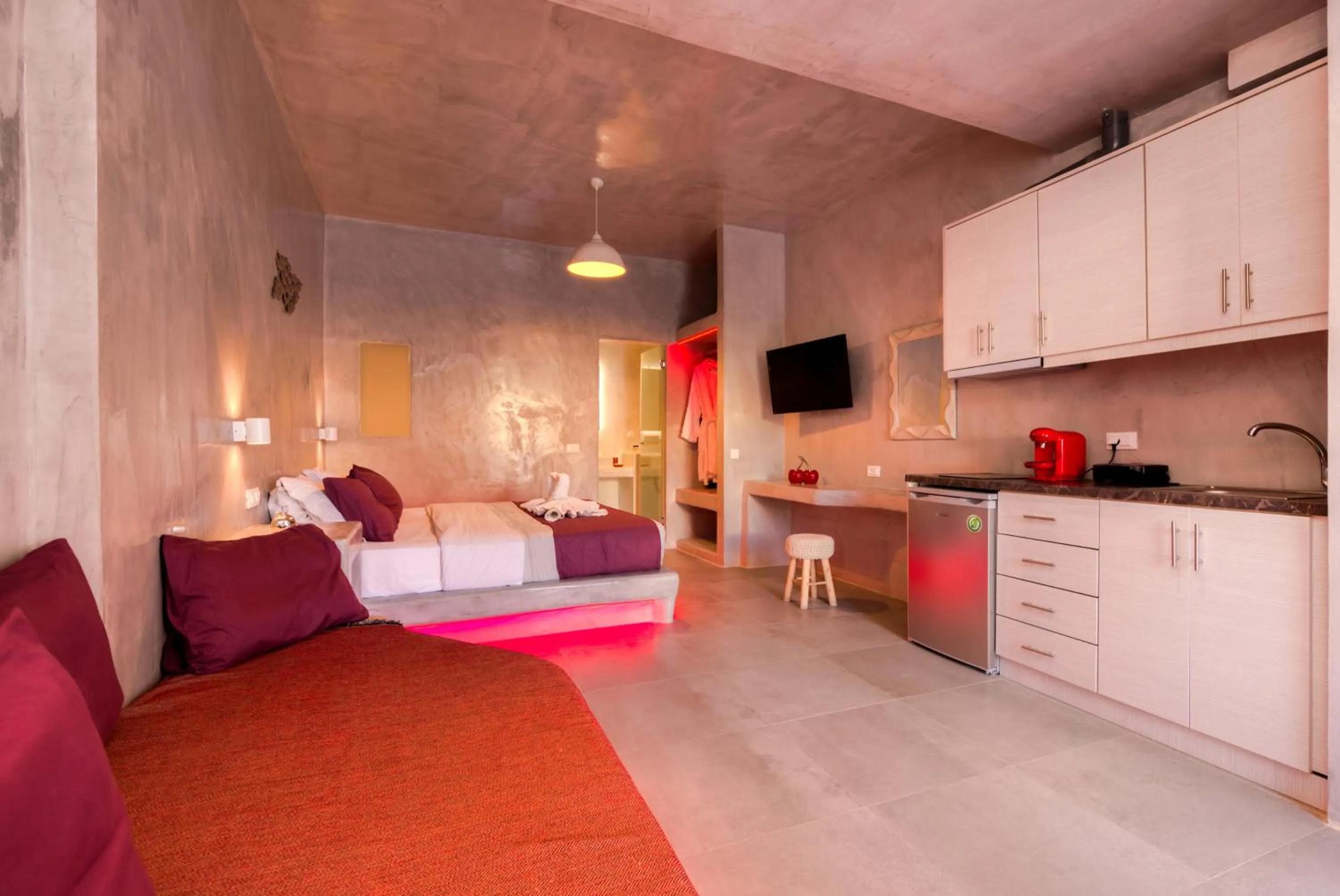 Photo of the whole room, Bed in The Muses of Santorini Private Jacuzzi Suites