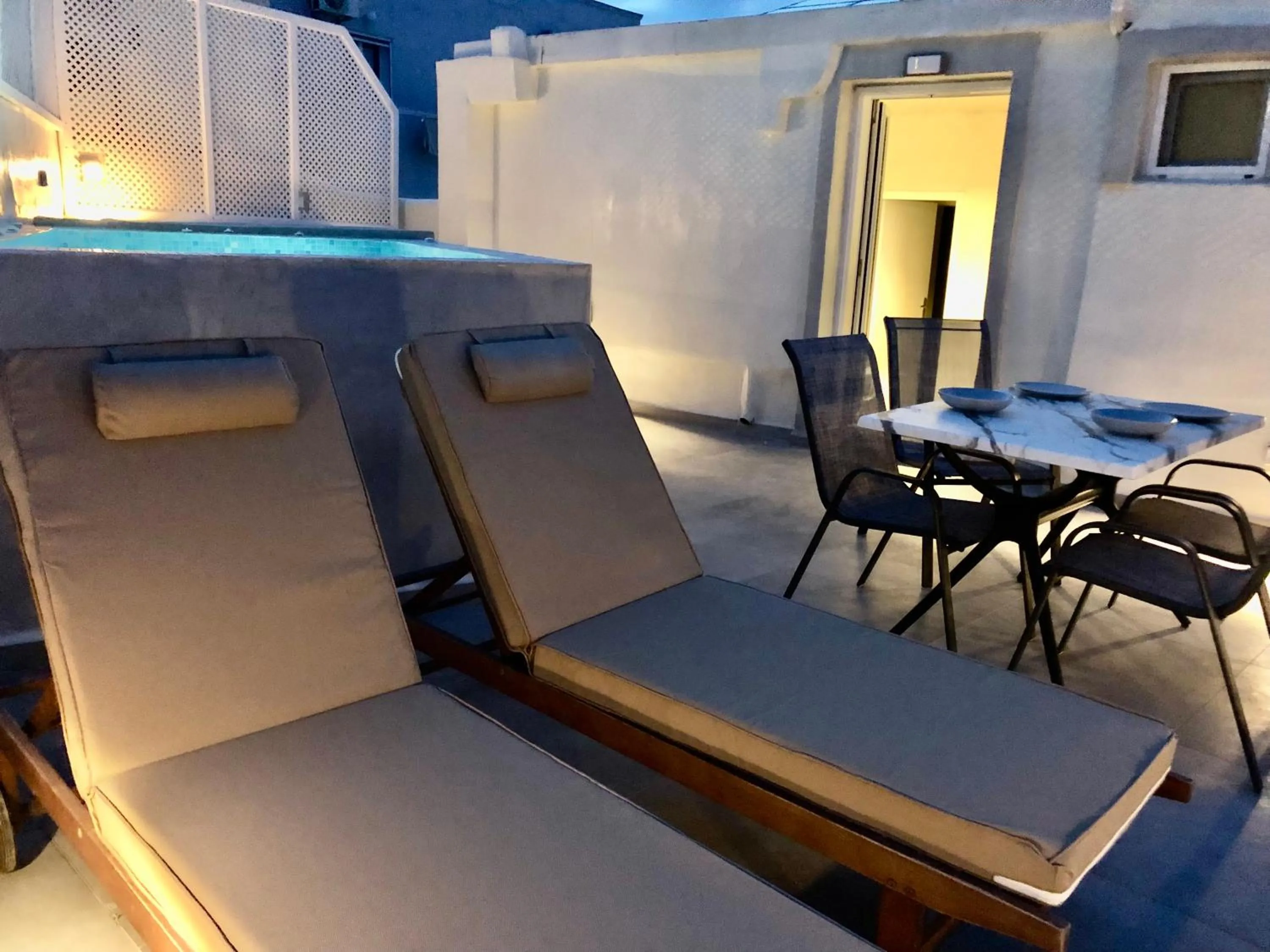 sunbed in The Muses of Santorini Private Jacuzzi Suites