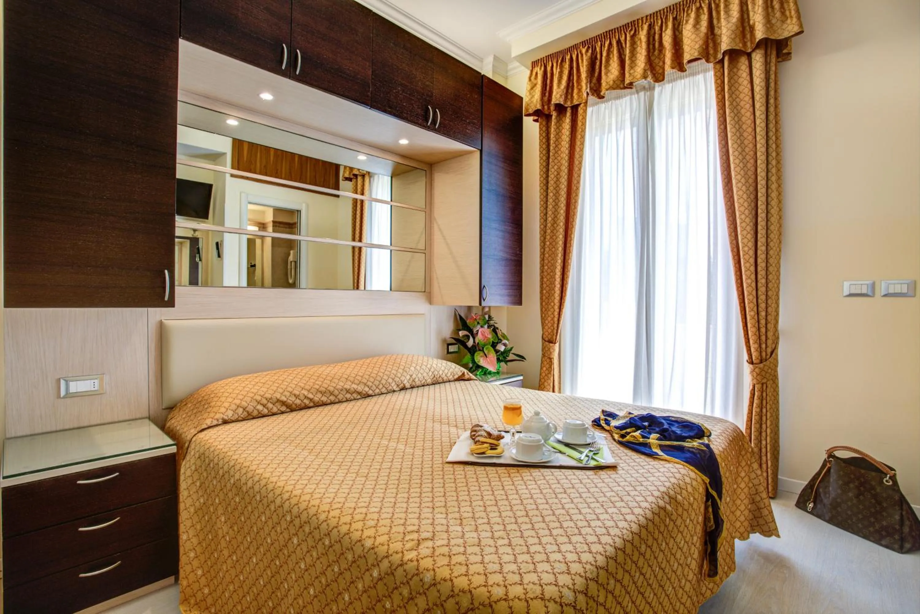 Bed in Hotel Caesar Paladium