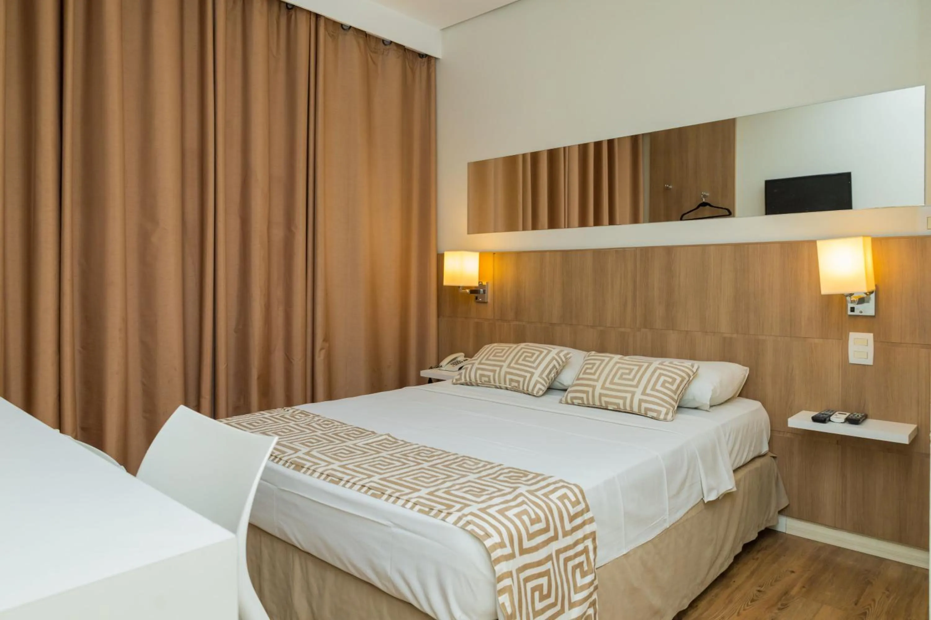 Bed in Golden Suíte Hotel