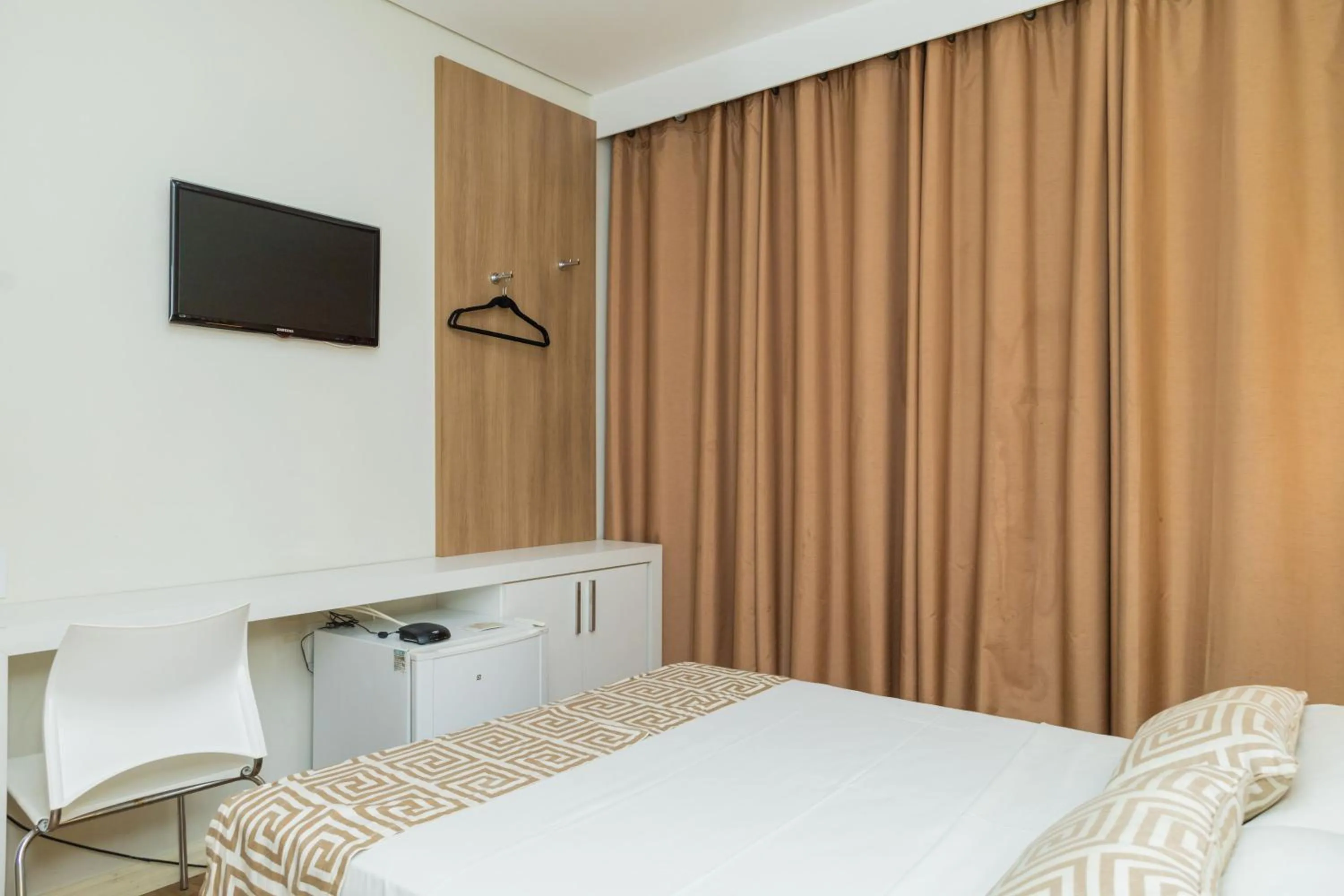 Bed in Golden Suíte Hotel