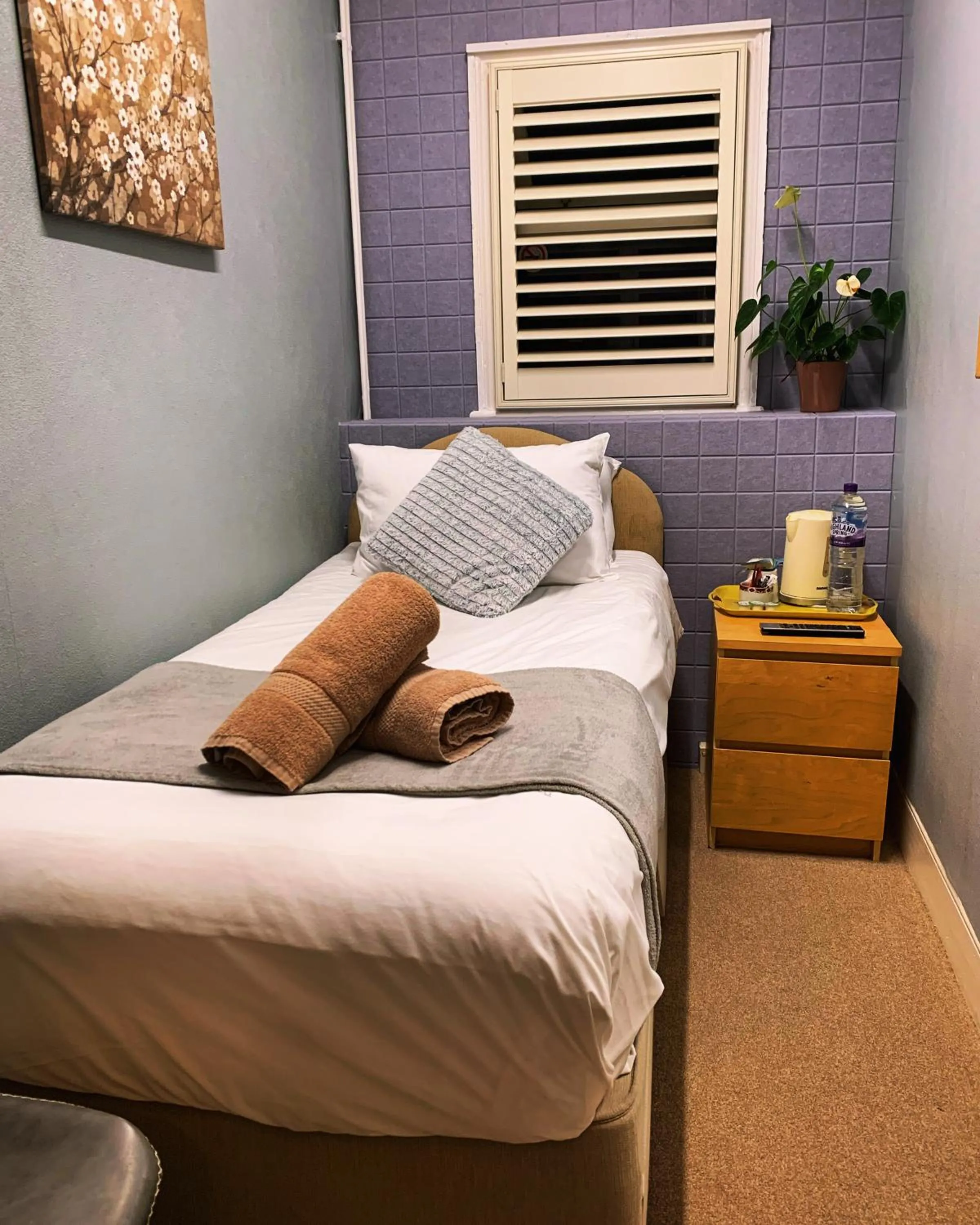 Bed in Relax Inn Guest House