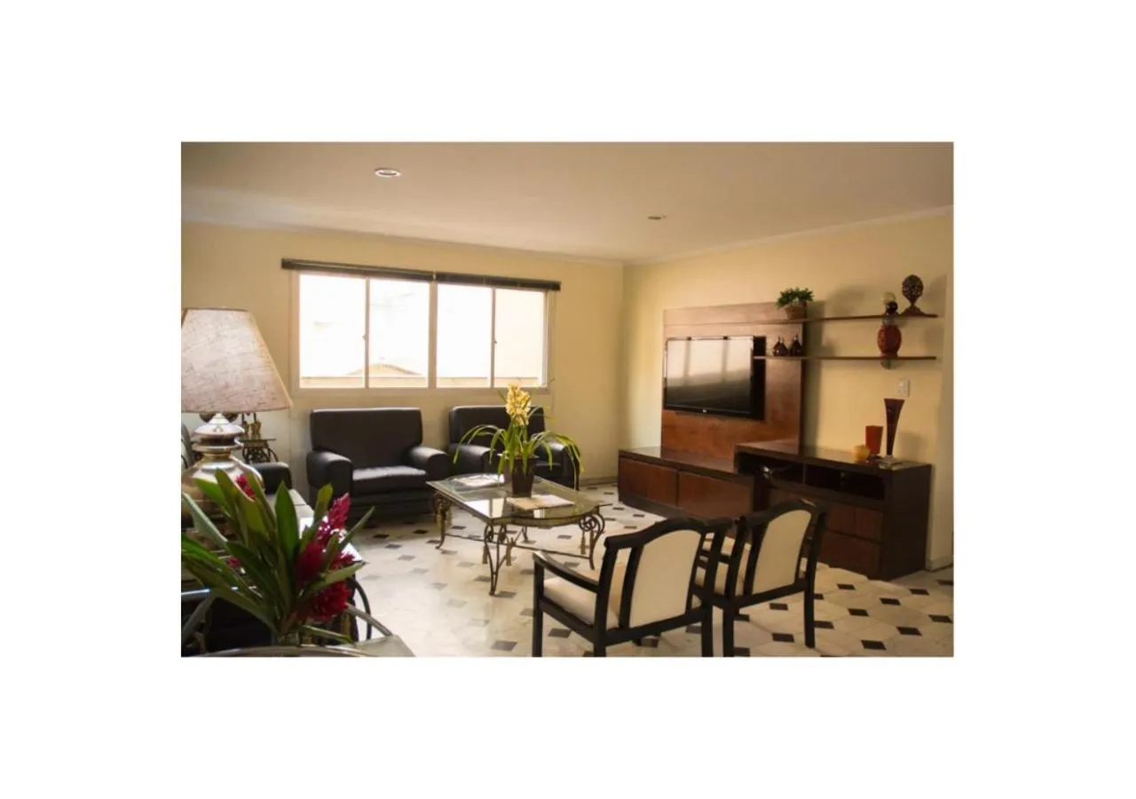 Communal lounge/ TV room in Mariano Palace Hotel