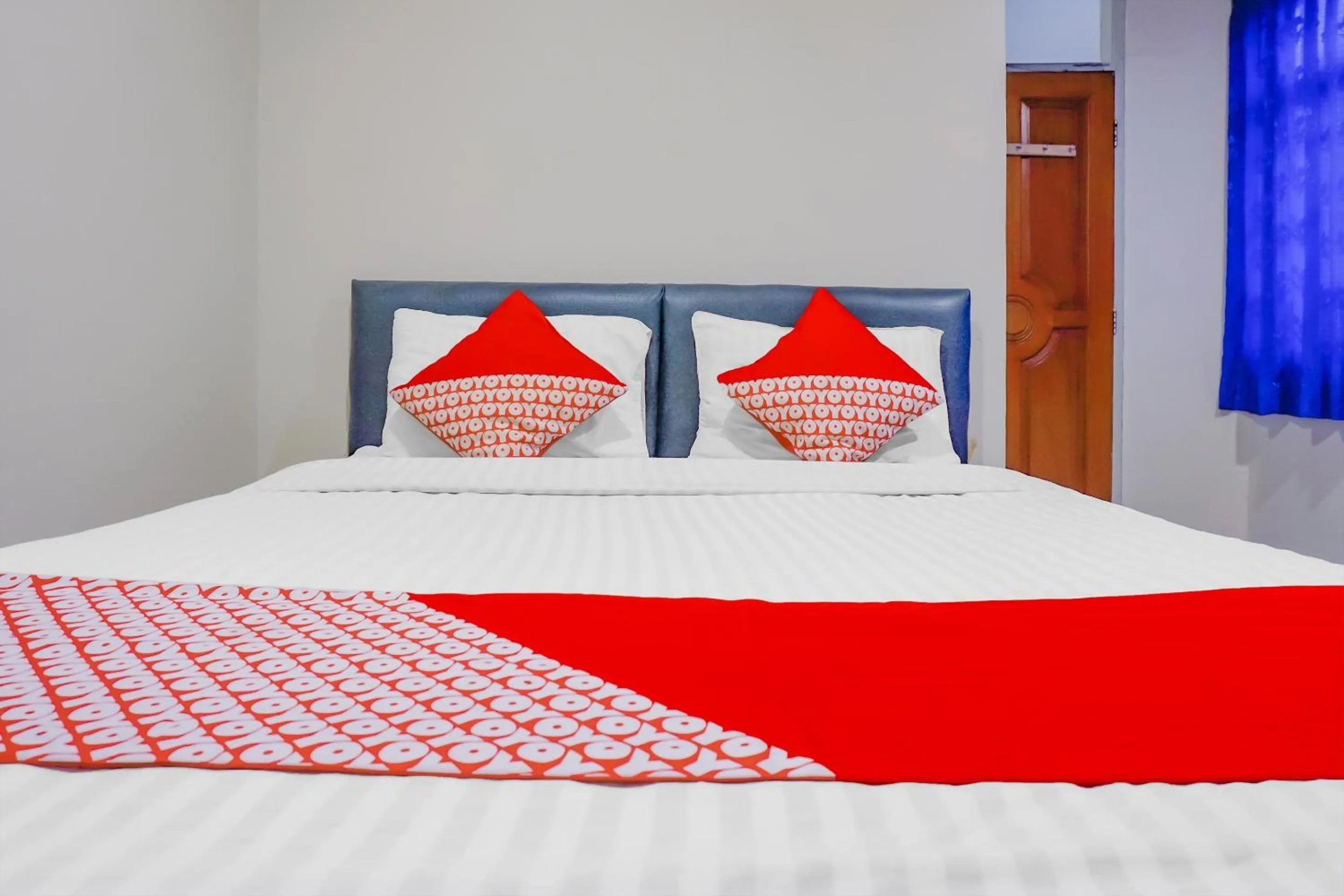 Bed in OYO 117 Blueberry Homestay