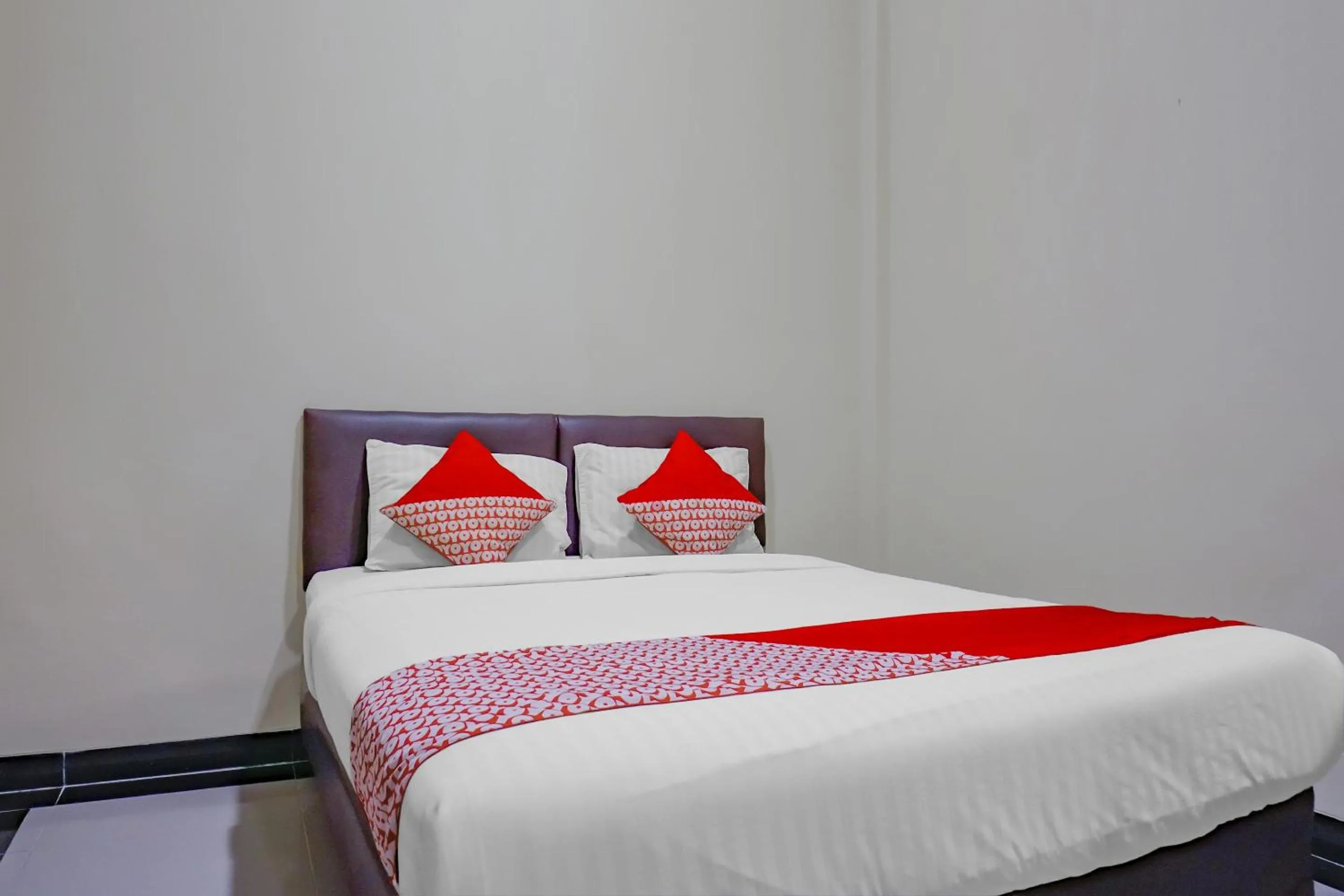 Bed in OYO 117 Blueberry Homestay