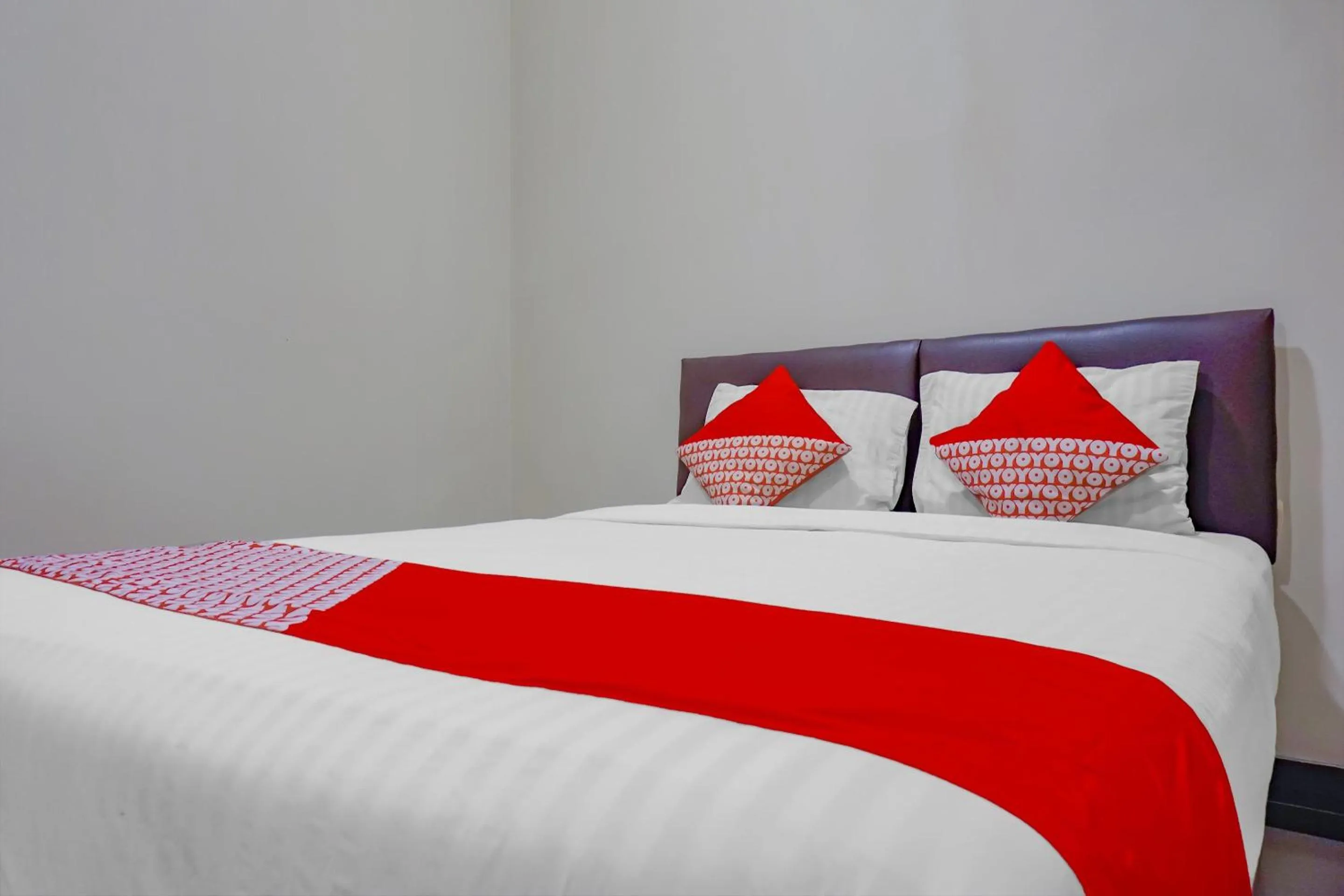 Bed in OYO 117 Blueberry Homestay