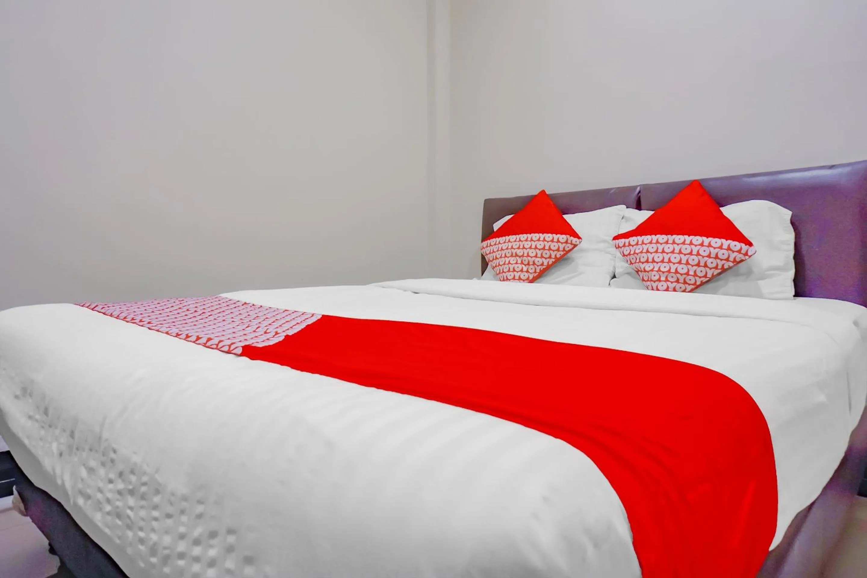 Bed in OYO 117 Blueberry Homestay