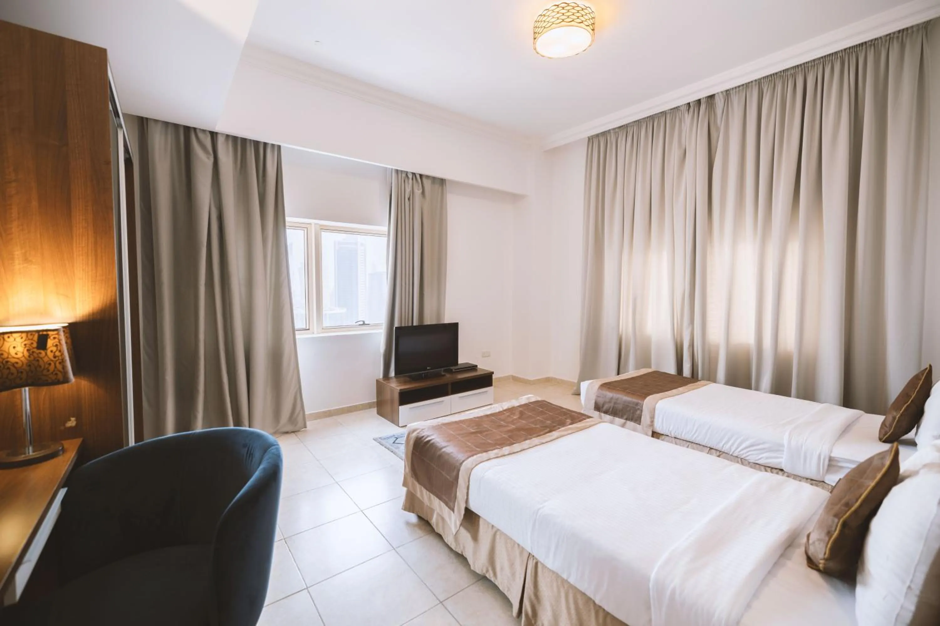 Bed in Magnum Hotel & Suites West Bay