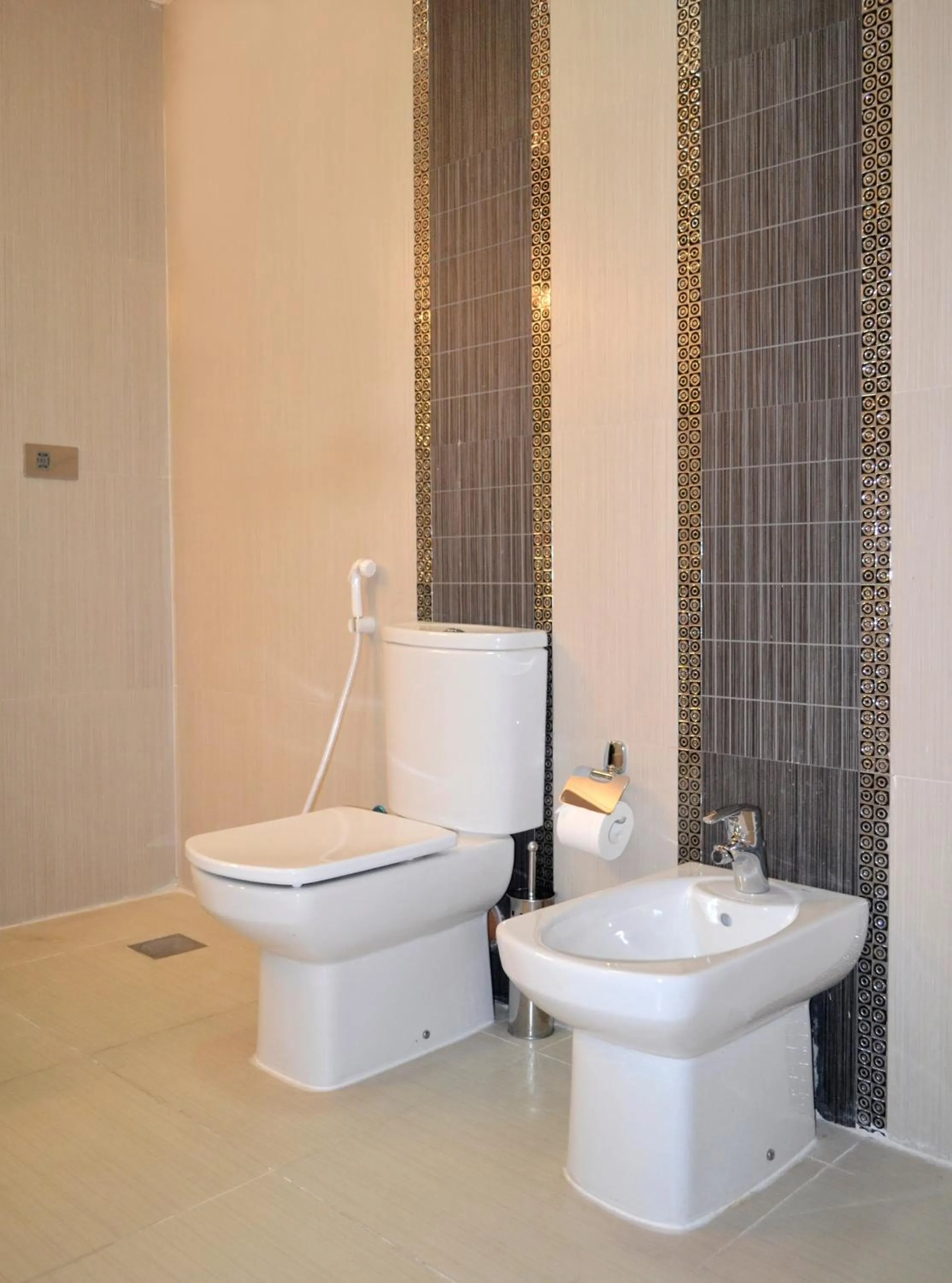 Toilet in Magnum Hotel & Suites West Bay