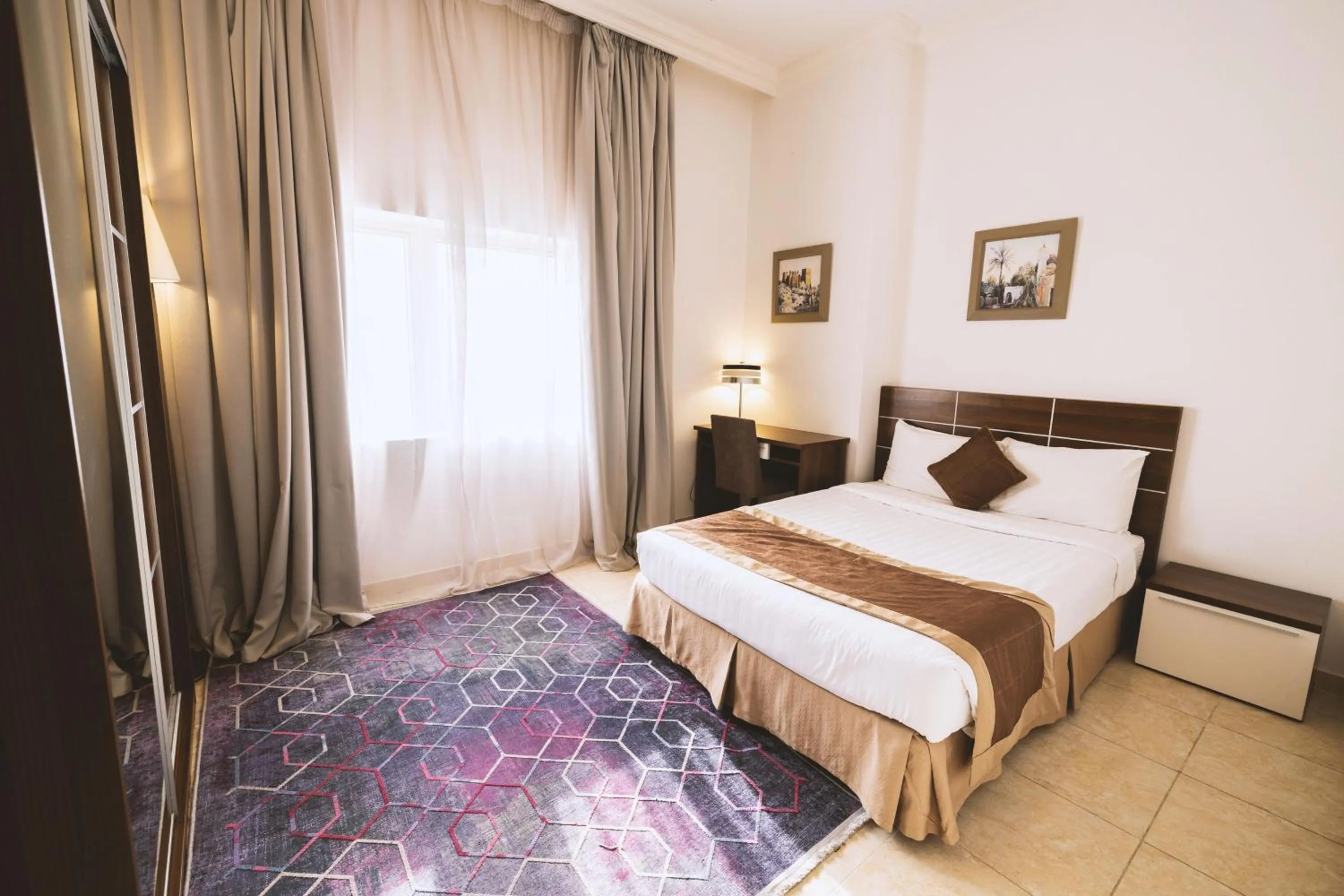 Bed in Magnum Hotel & Suites West Bay