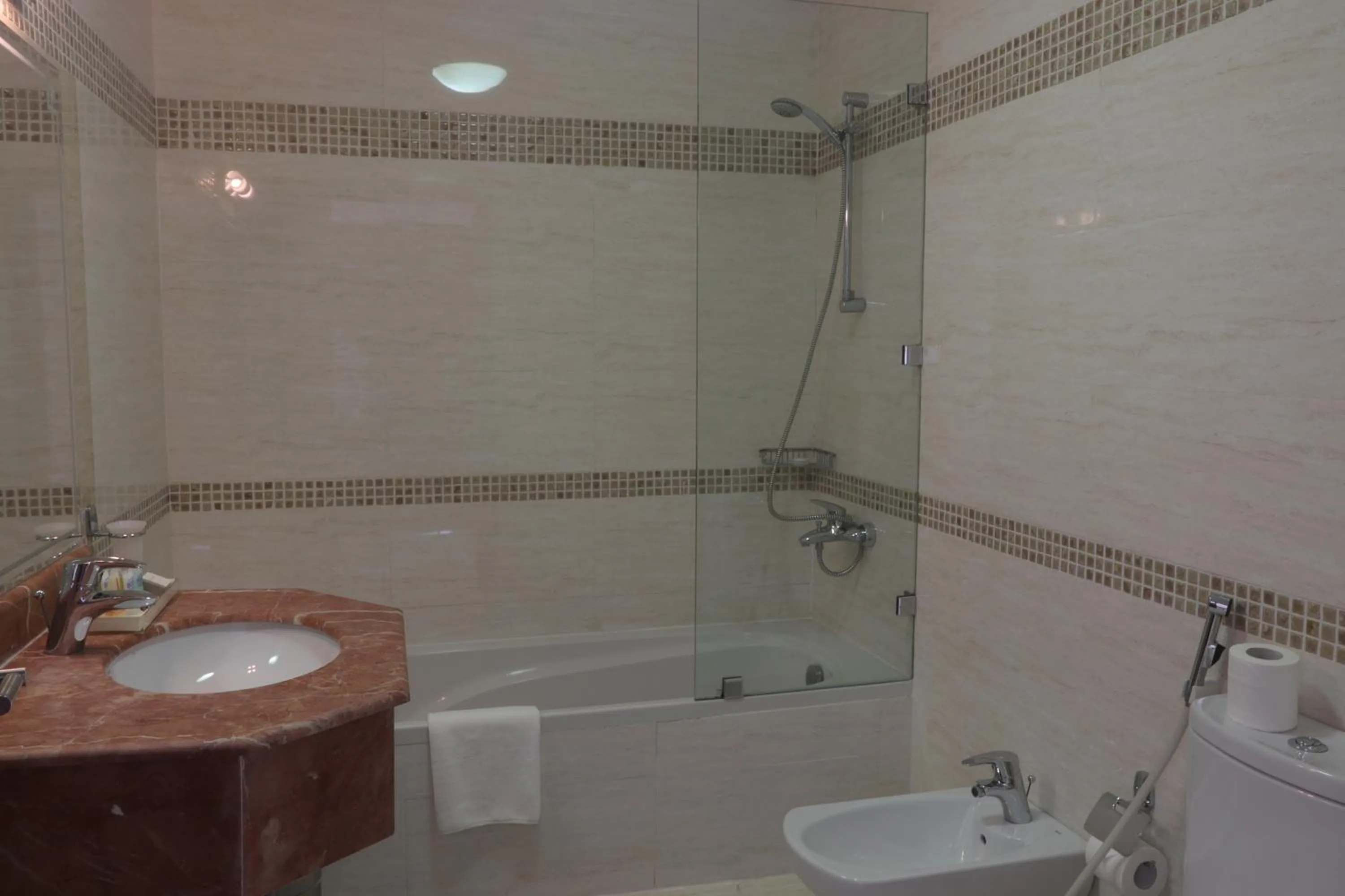 Bathroom in Magnum Hotel & Suites West Bay