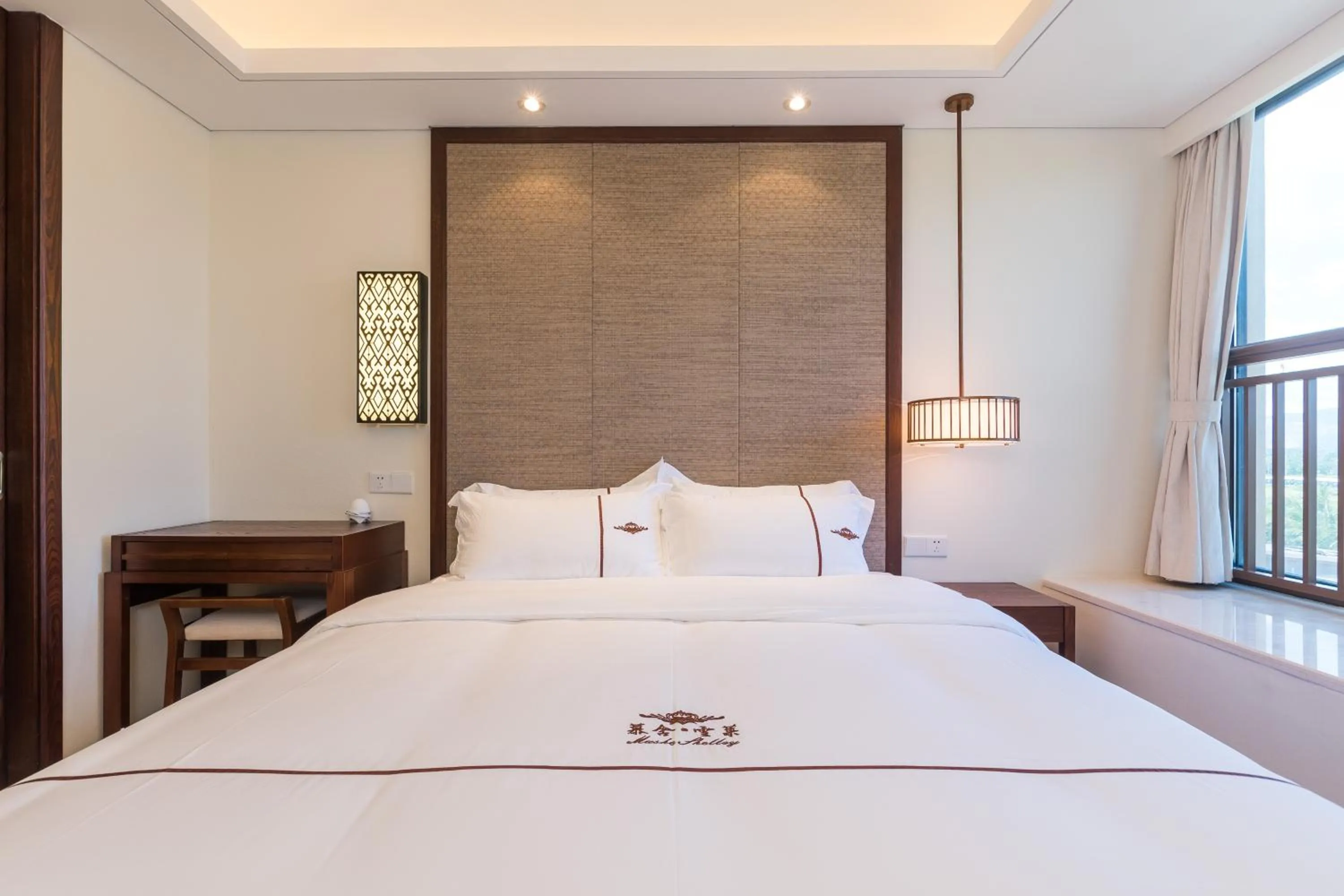 Bed in Sanya Haitang Bay Mushe Villa