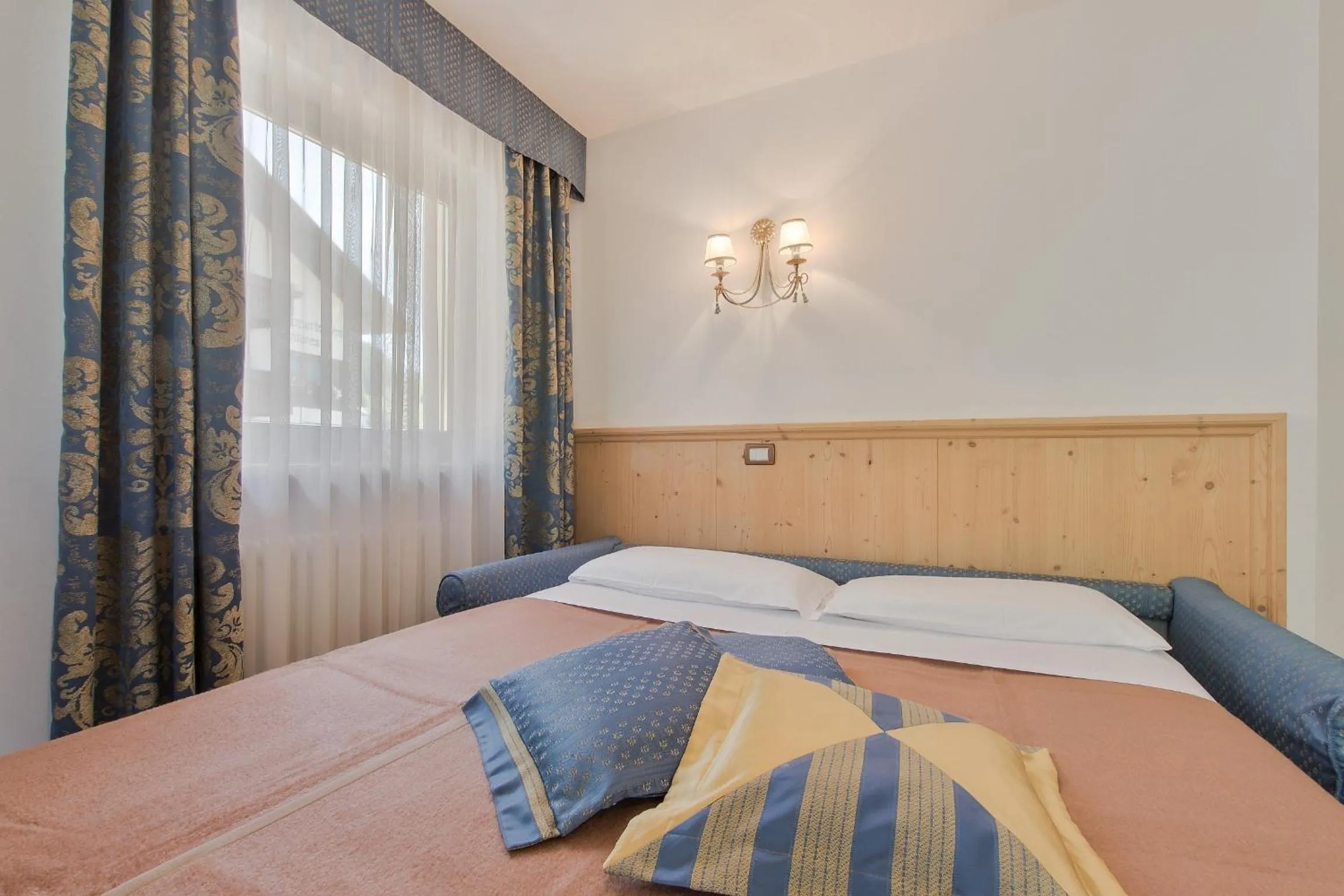 Bed in Garnì La Dorada