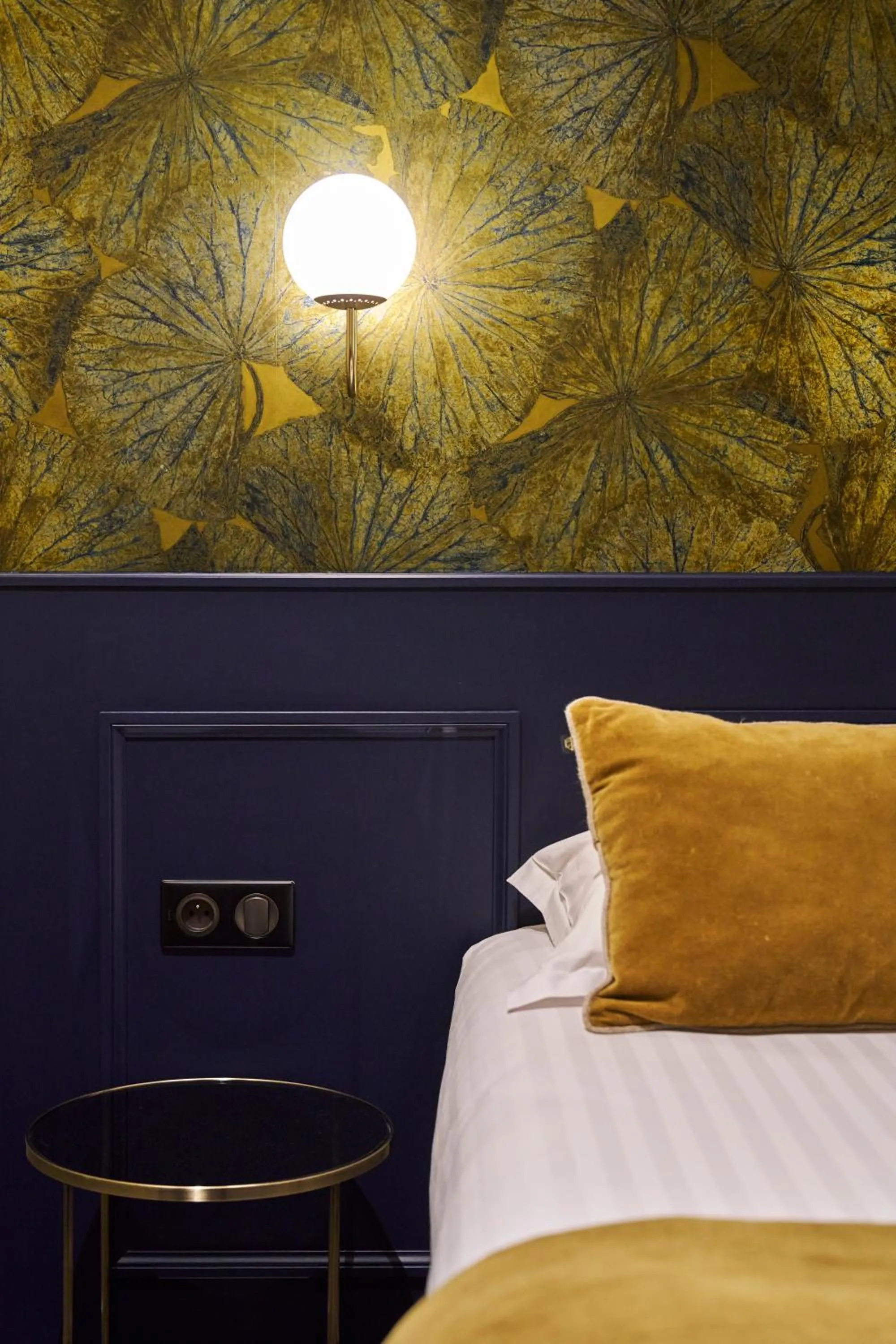 Decorative detail, Bed in Hôtel le Corbusson Laval Ouest