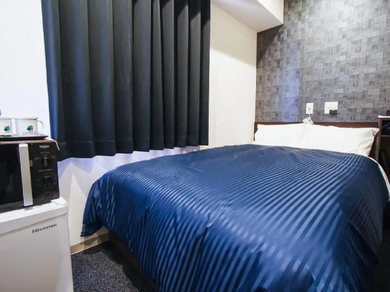 Bed in HOTEL LiVEMAX Himeji Shiyakusho Mae