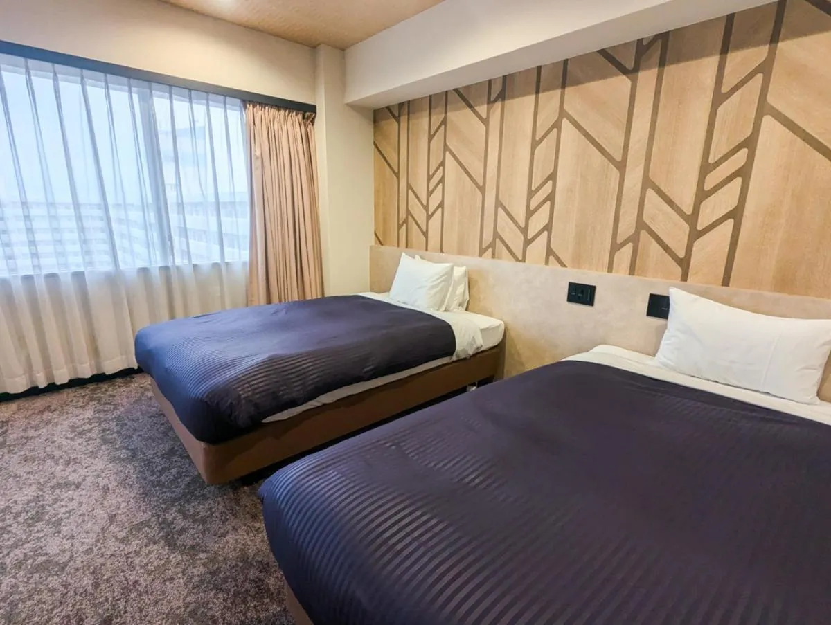 Bed in HOTEL LiVEMAX BUDGET Kagoshima