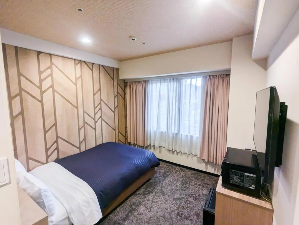 Bed in HOTEL LiVEMAX BUDGET Kagoshima