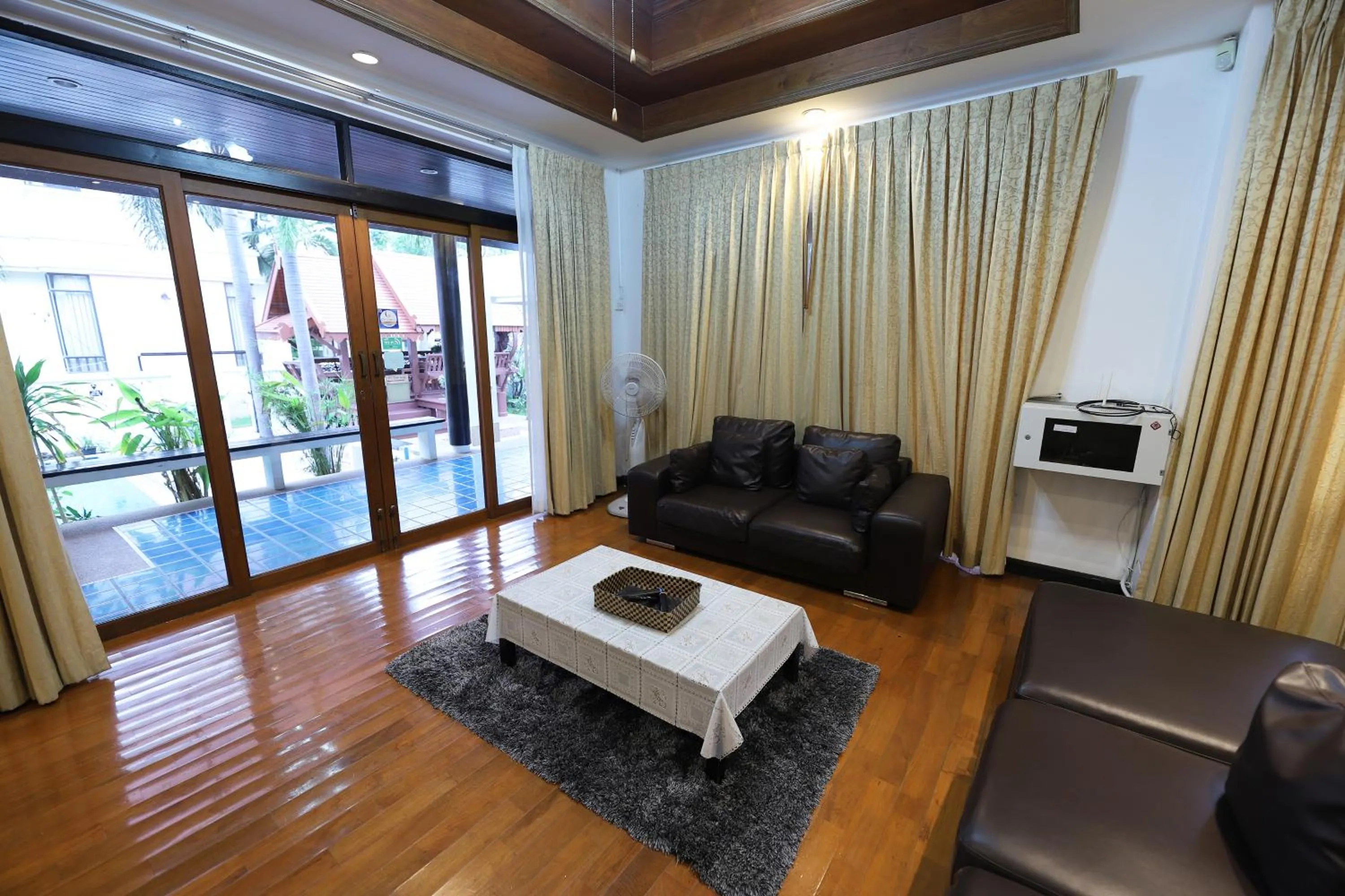 Living room in ปุณณภา พูล วิลล่า พัทยา Punnapha Pool Villa Pattaya