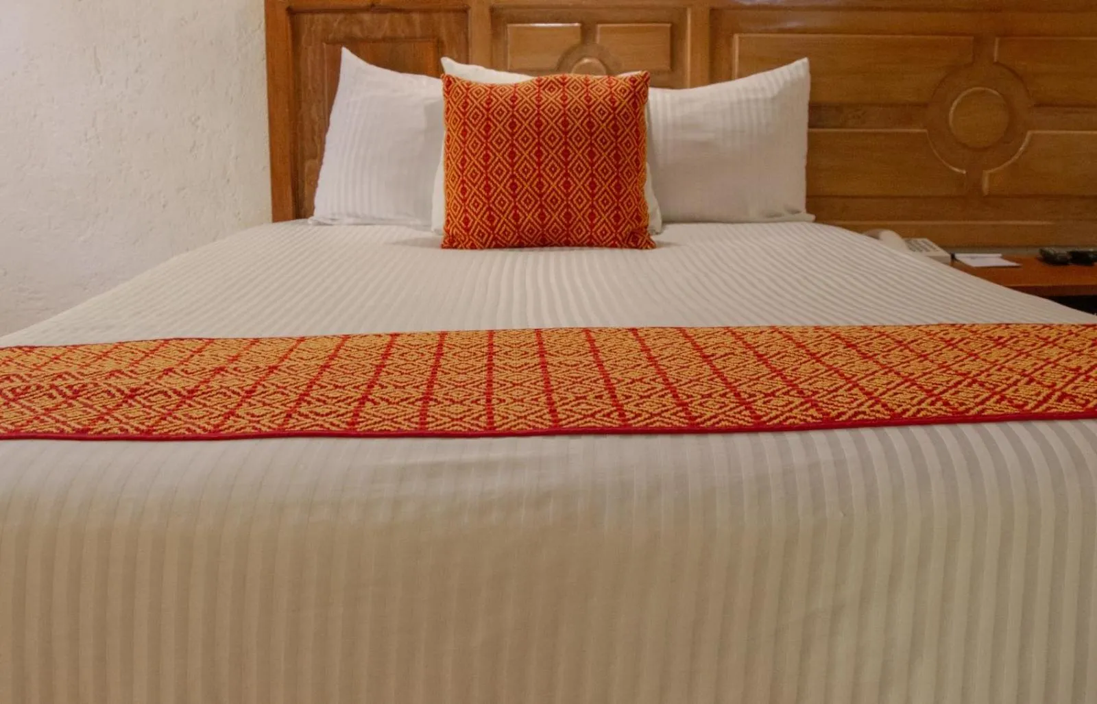 Bed in Hotel Diego de Mazariegos