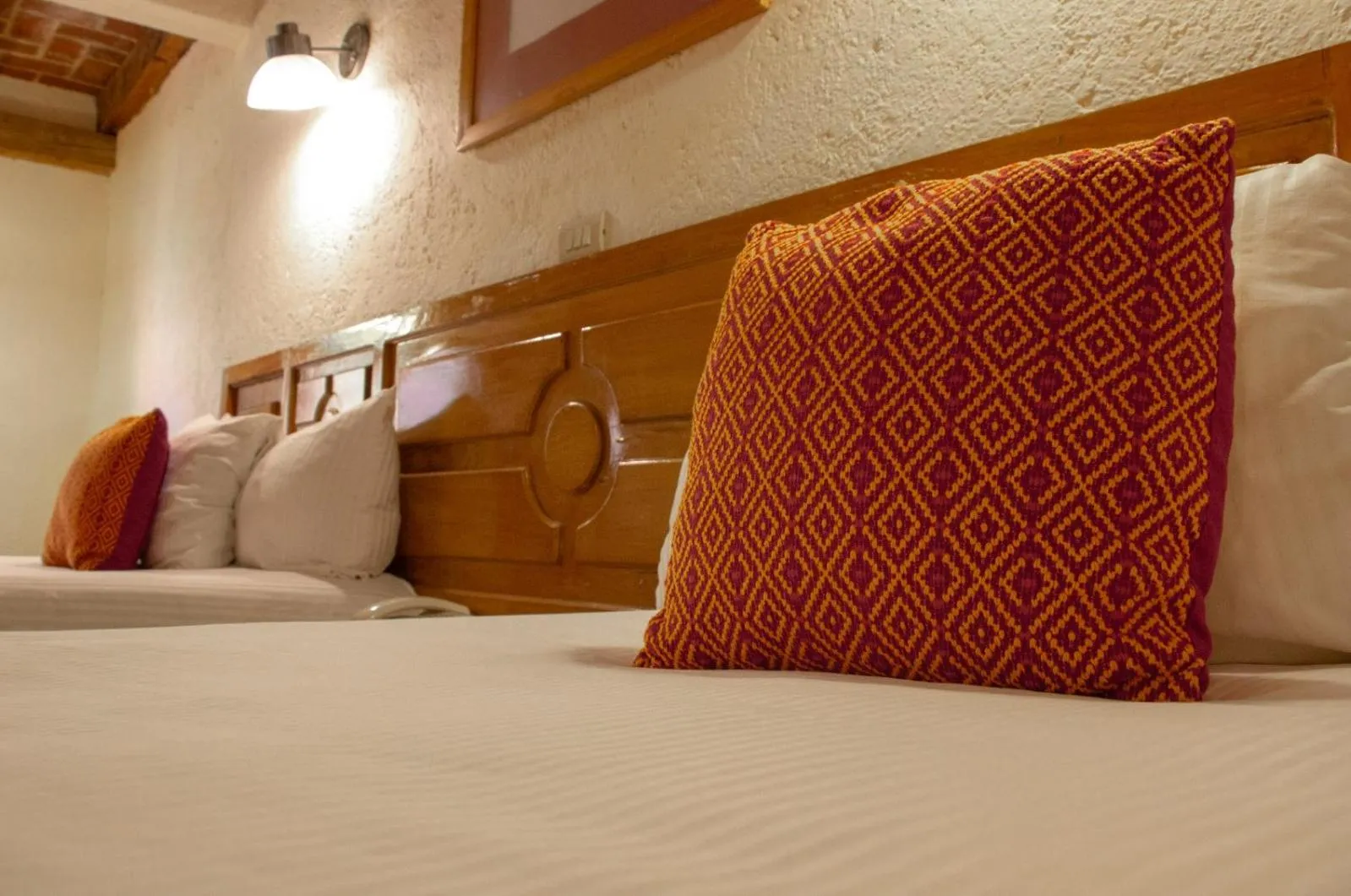 Bed in Hotel Diego de Mazariegos