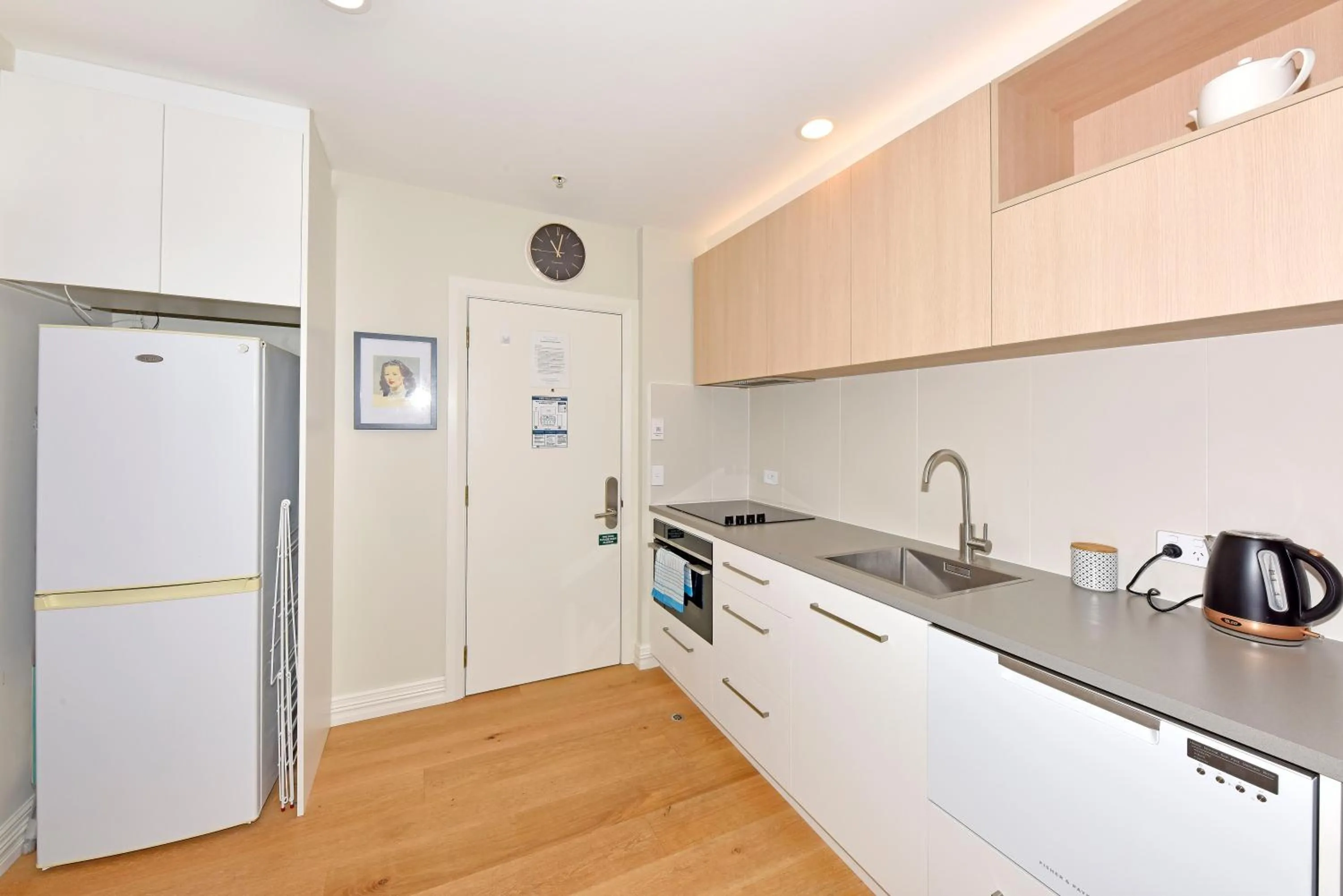 Kitchen or kitchenette in West Fitzroy Apartments