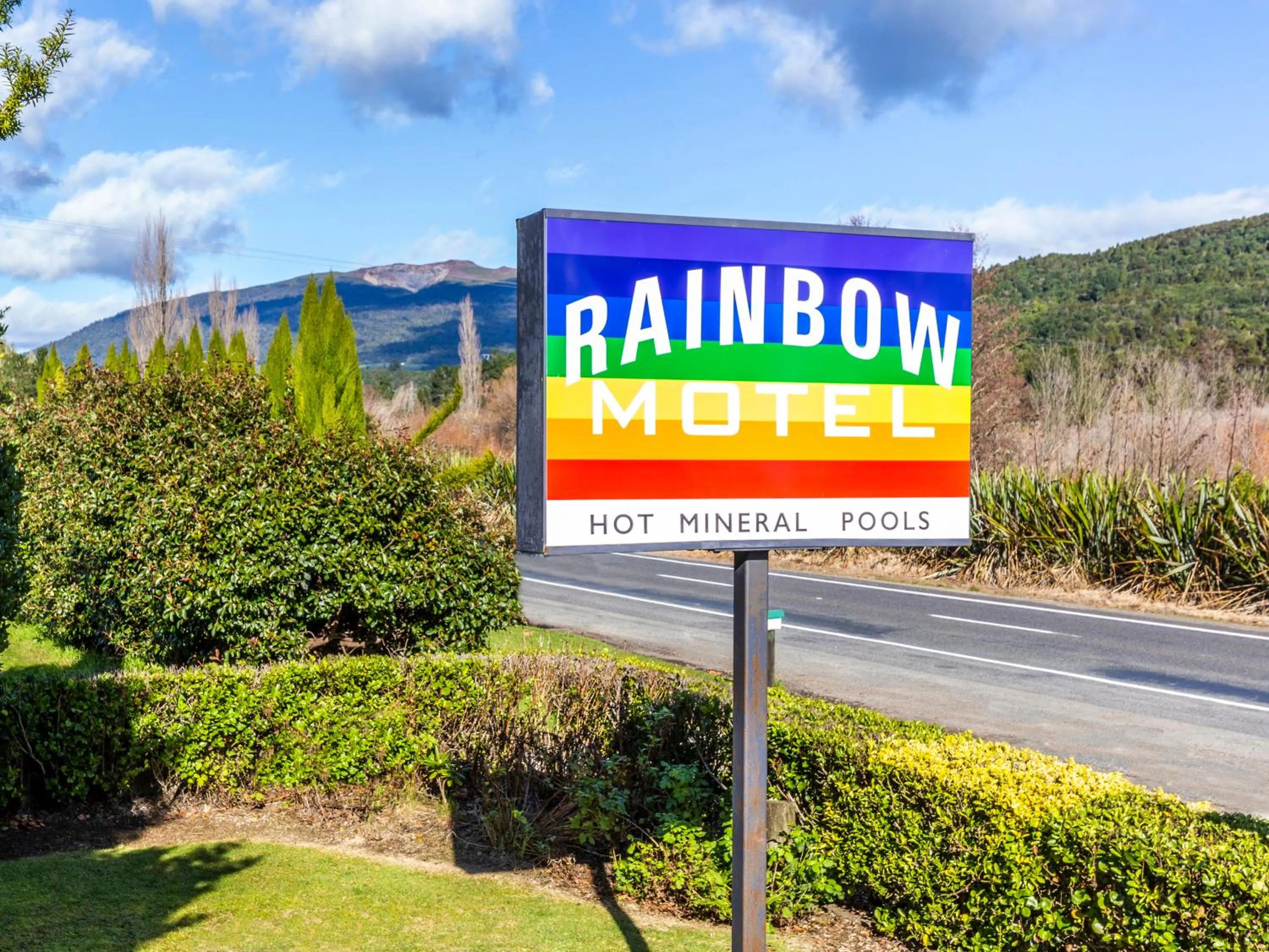 Property logo or sign in Rainbow Motel & Hot Pools
