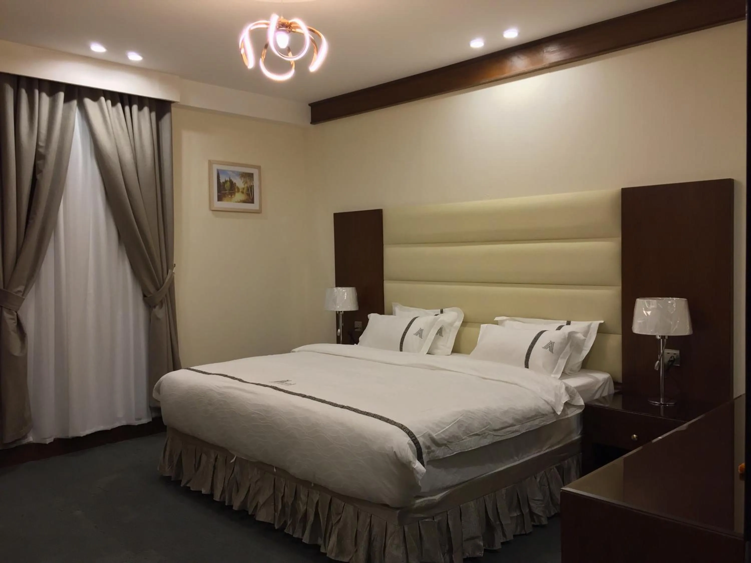 Bed in Aral Hotel Apartments