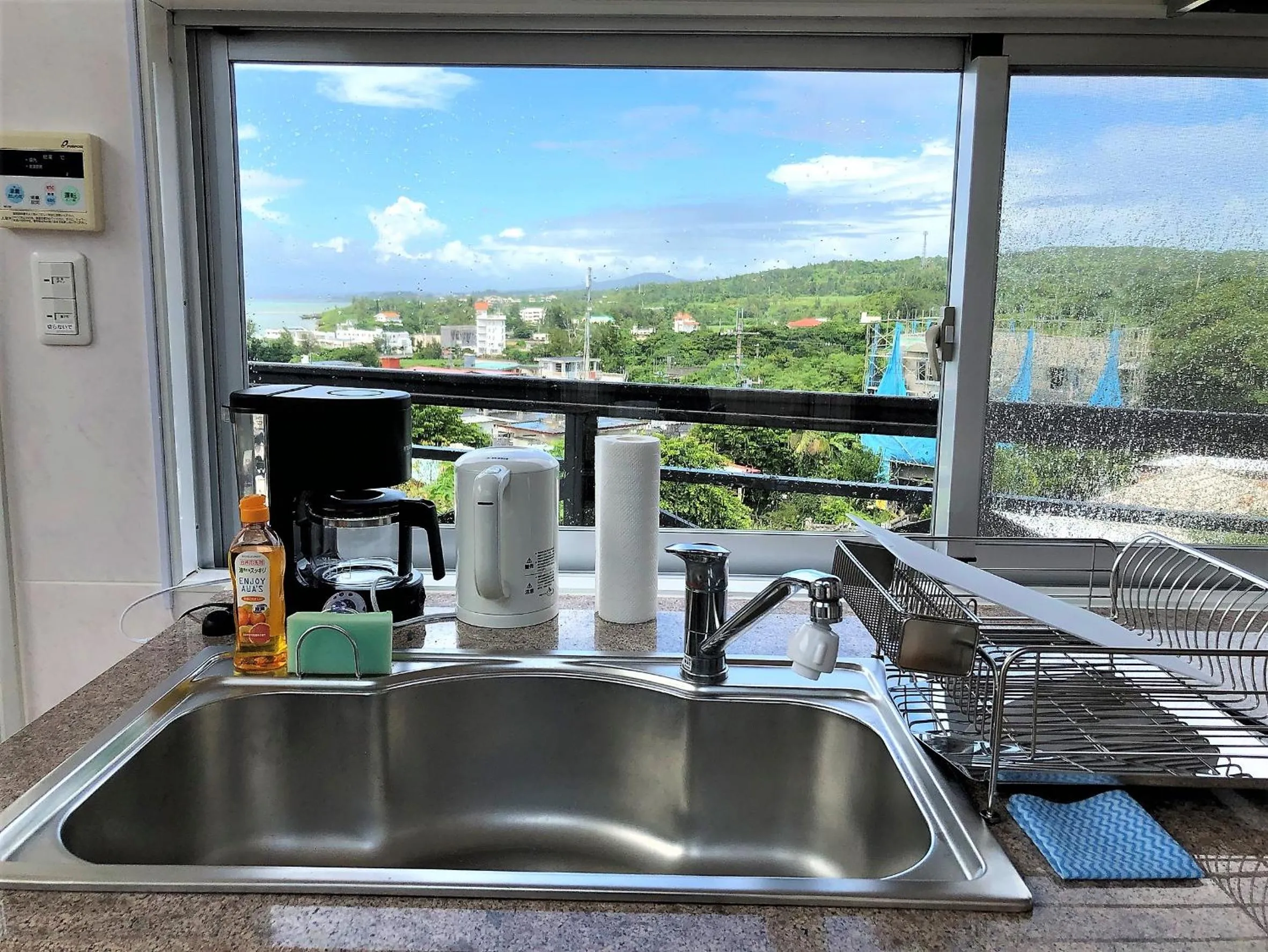 Kitchen or kitchenette in E-horizon Resort Condominium Yomitan