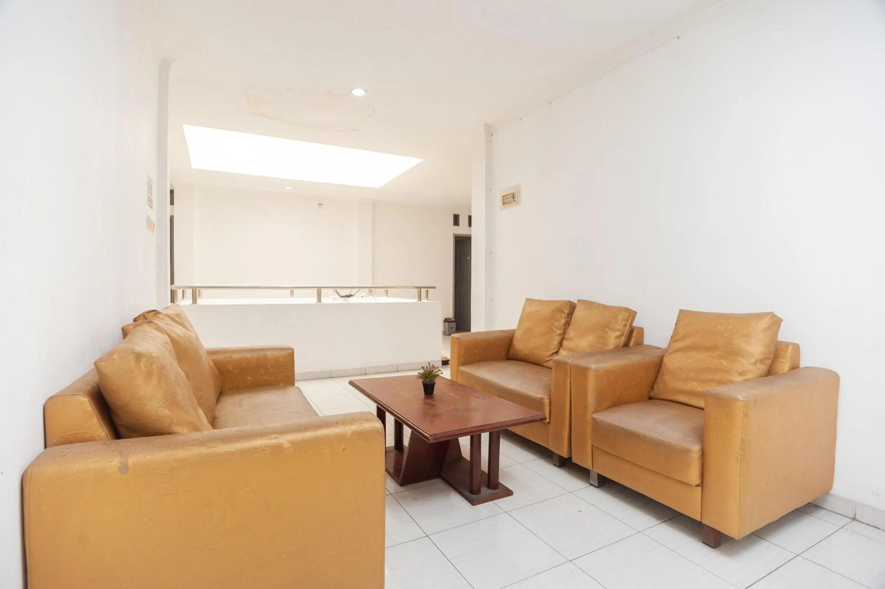 Living room in RedDoorz Syariah near Grand Galaxy Park