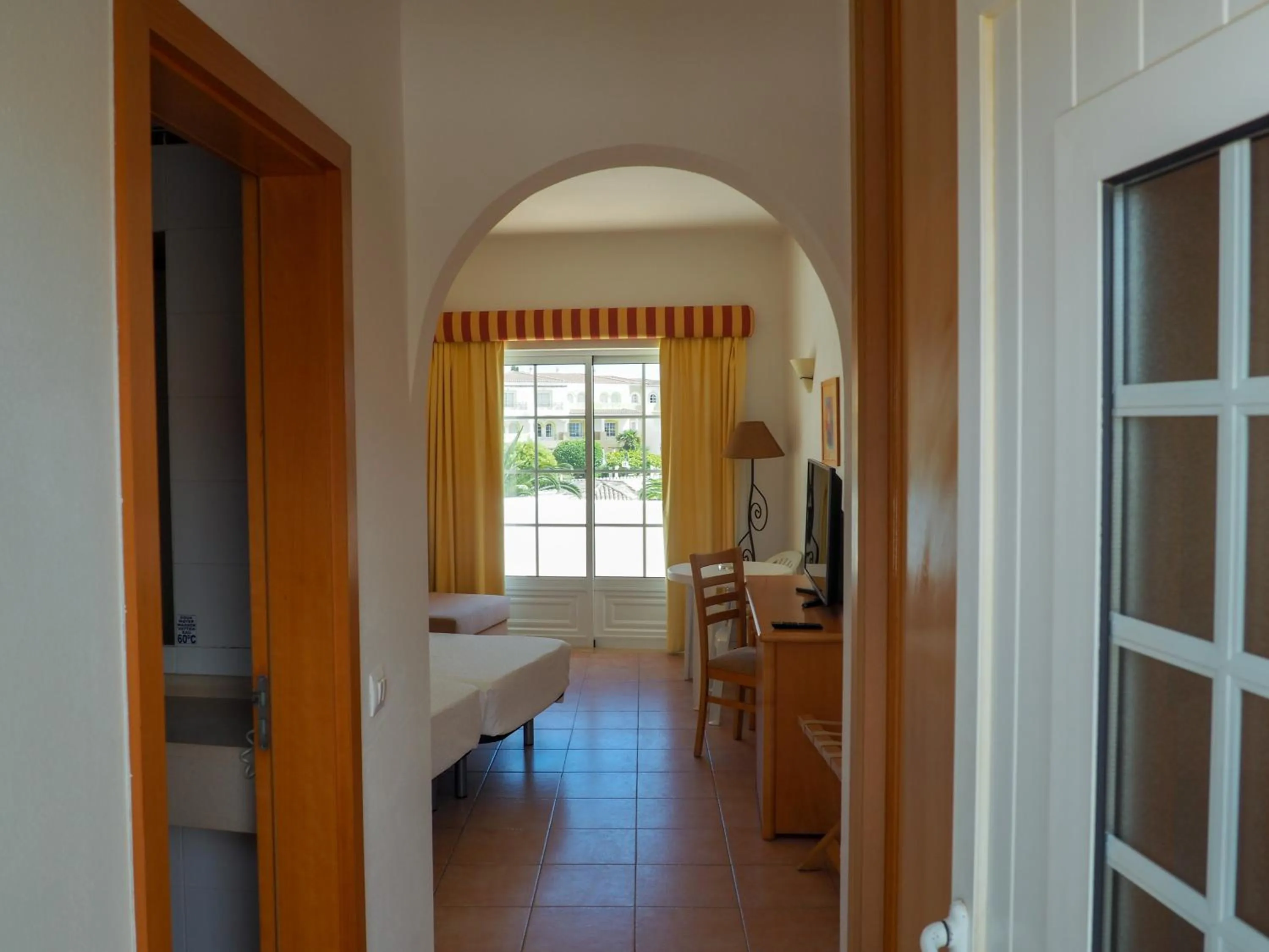 Bed in Luz Bay Hotel