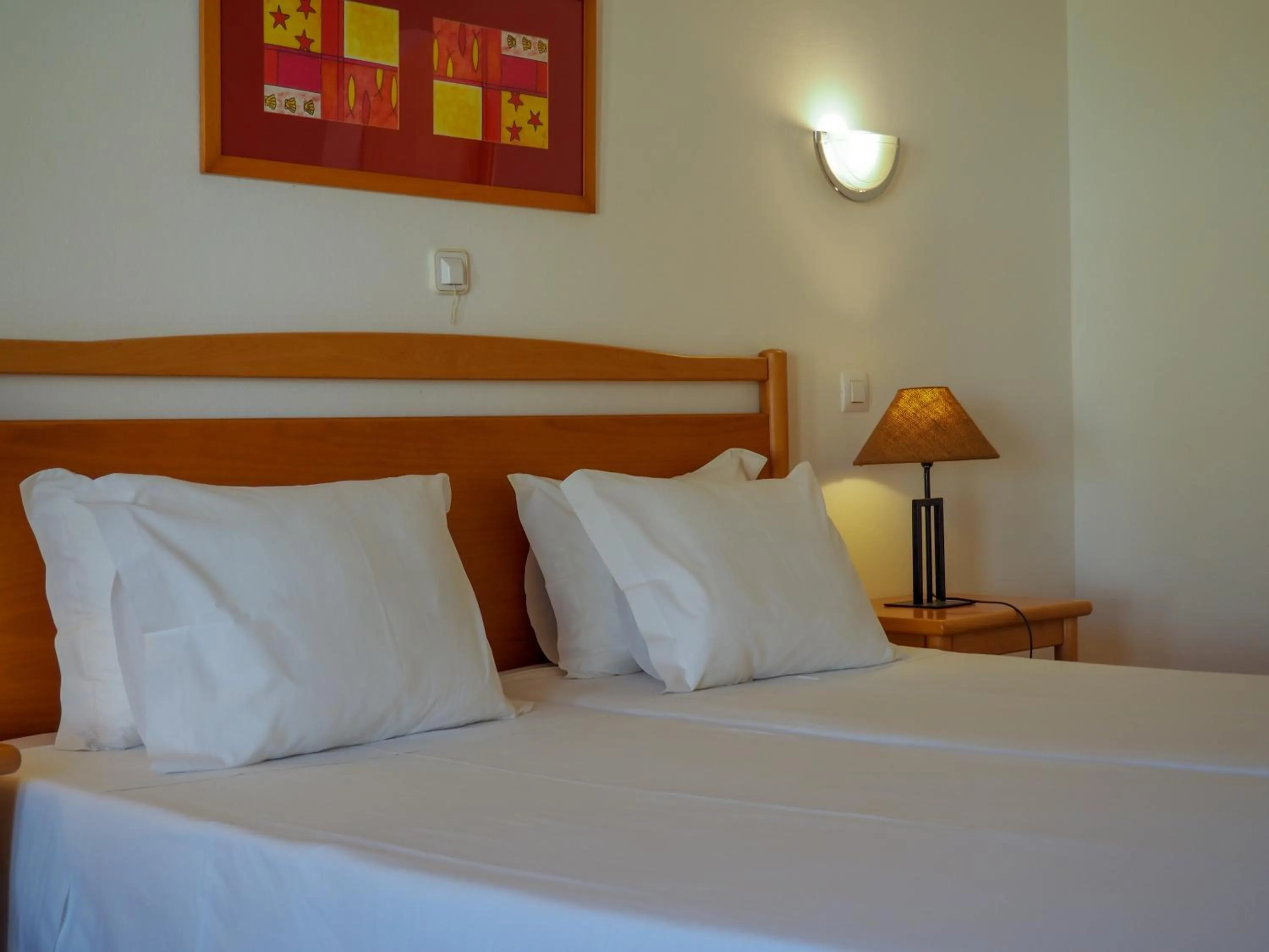 Bed in Luz Bay Hotel