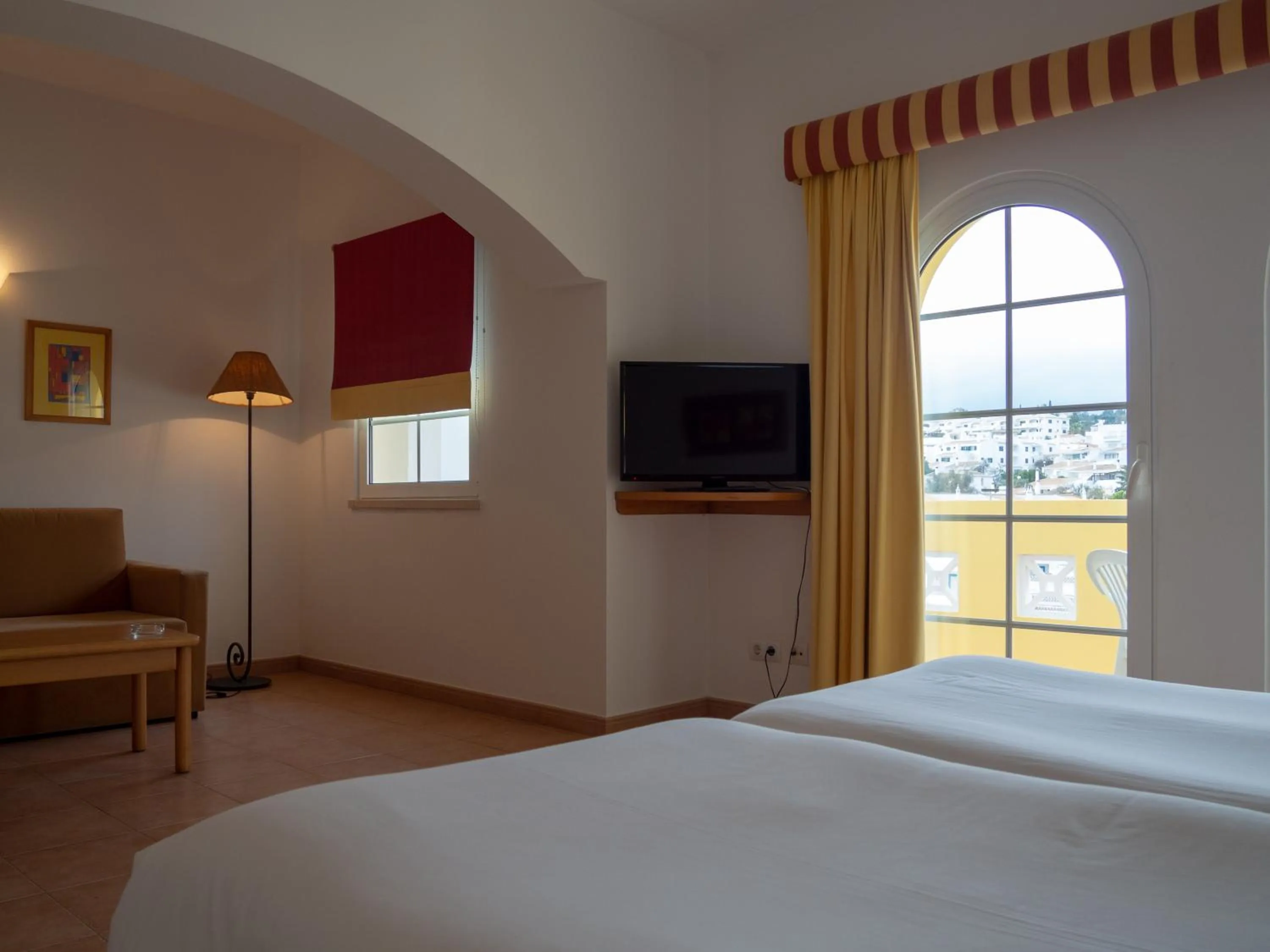 Bed in Luz Bay Hotel