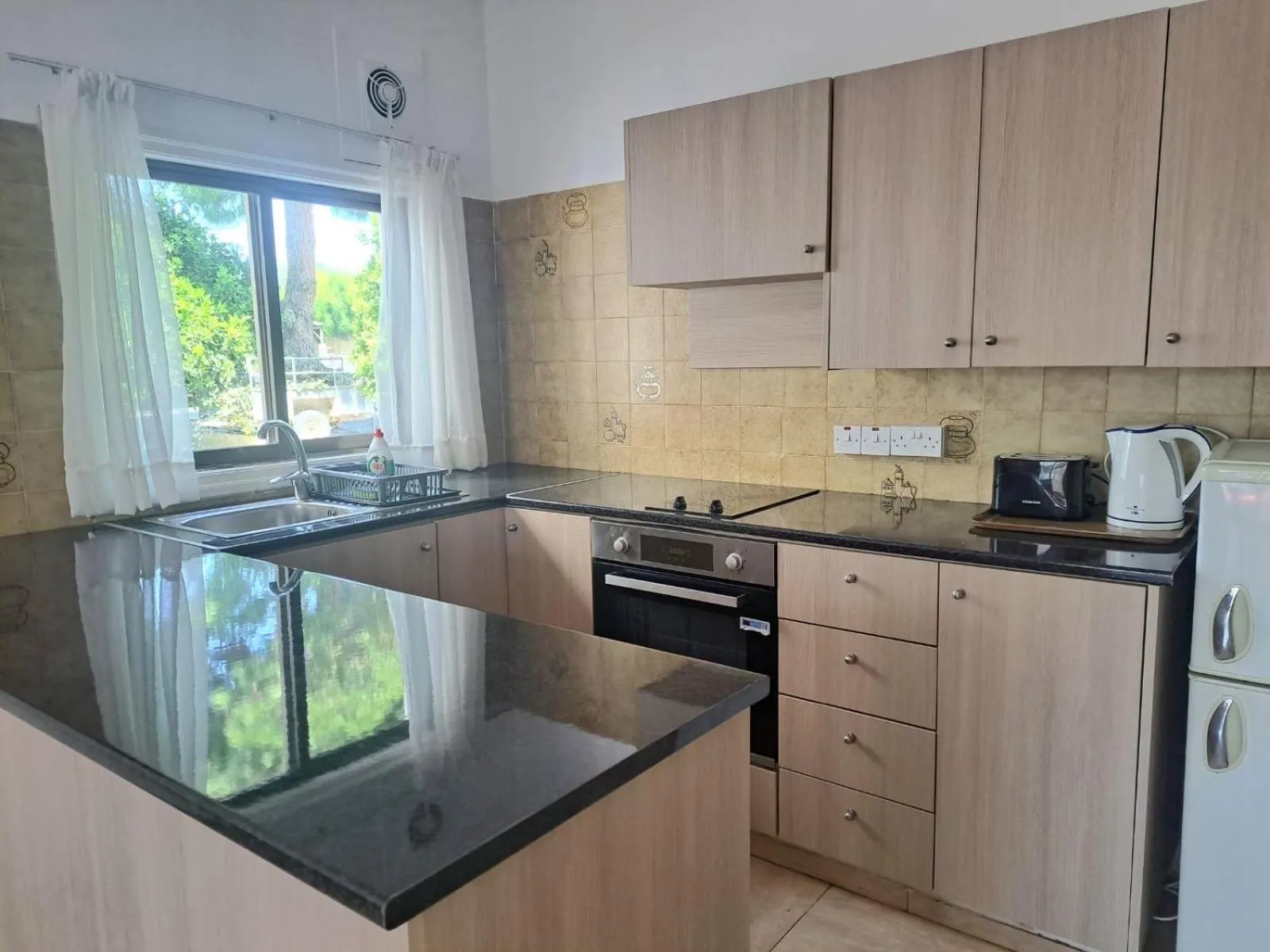 Kitchen or kitchenette in Florence Hotel Apartments