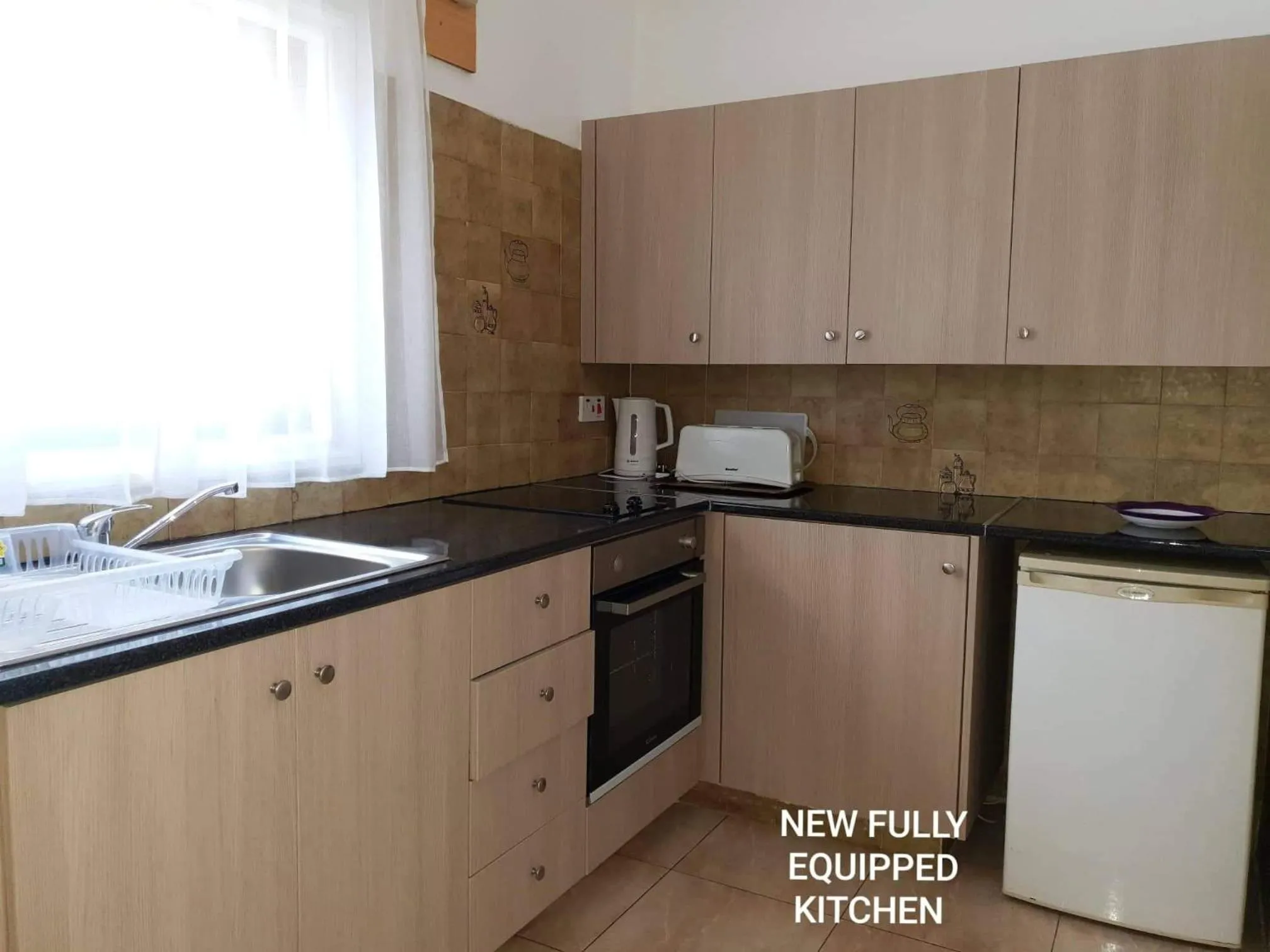 Kitchen or kitchenette in Florence Hotel Apartments