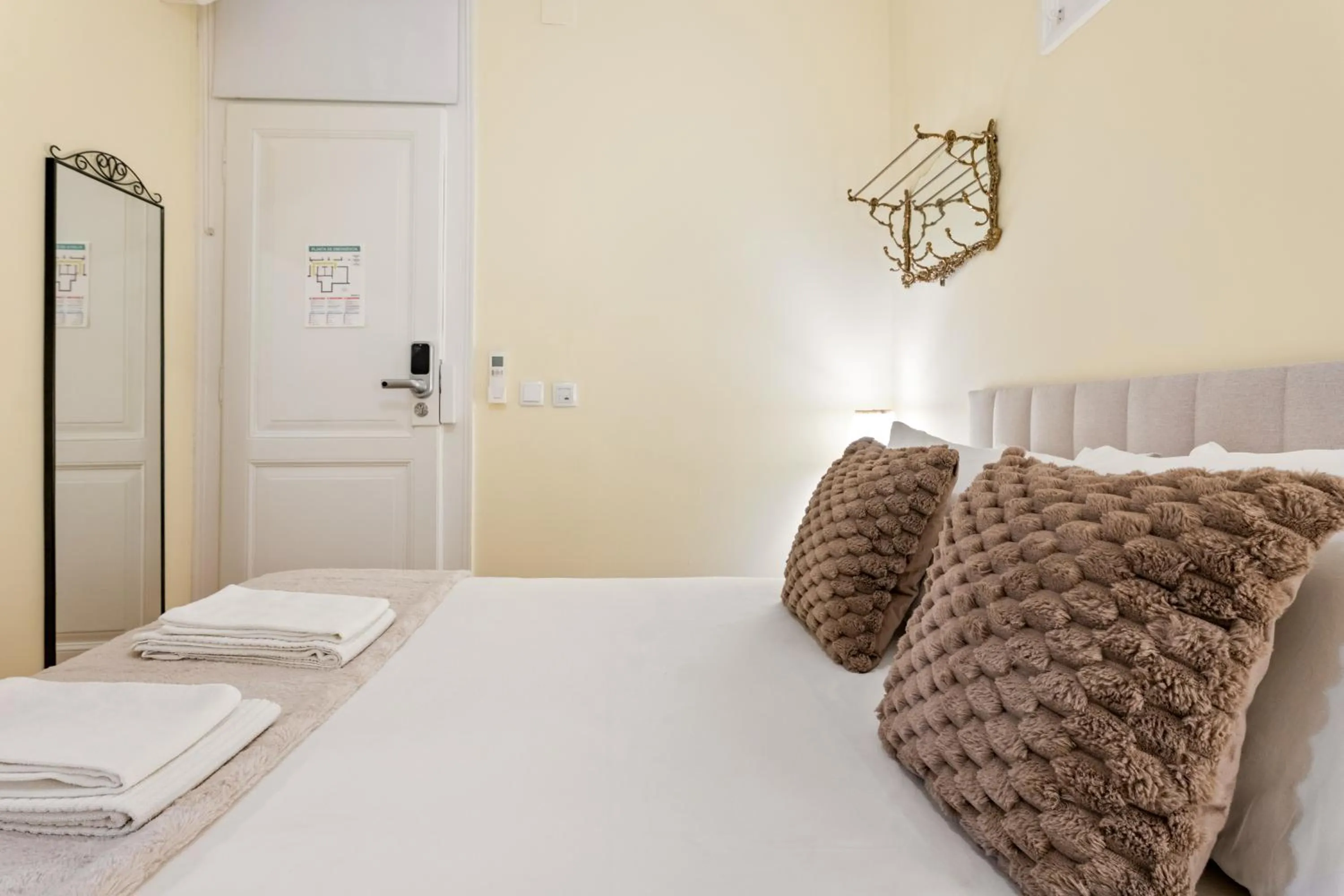 Bed in 1898 Home & Suites