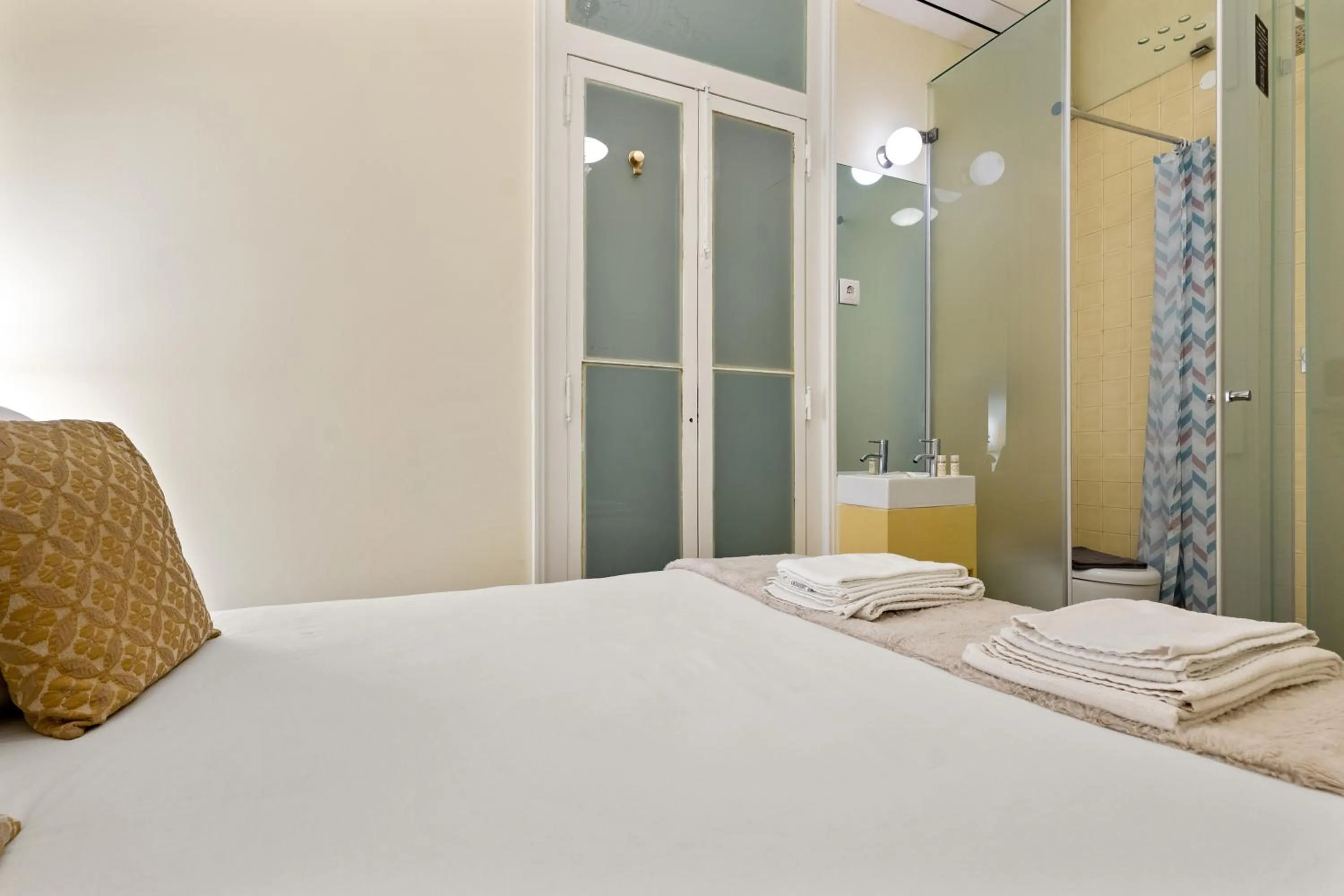 Bed in 1898 Home & Suites