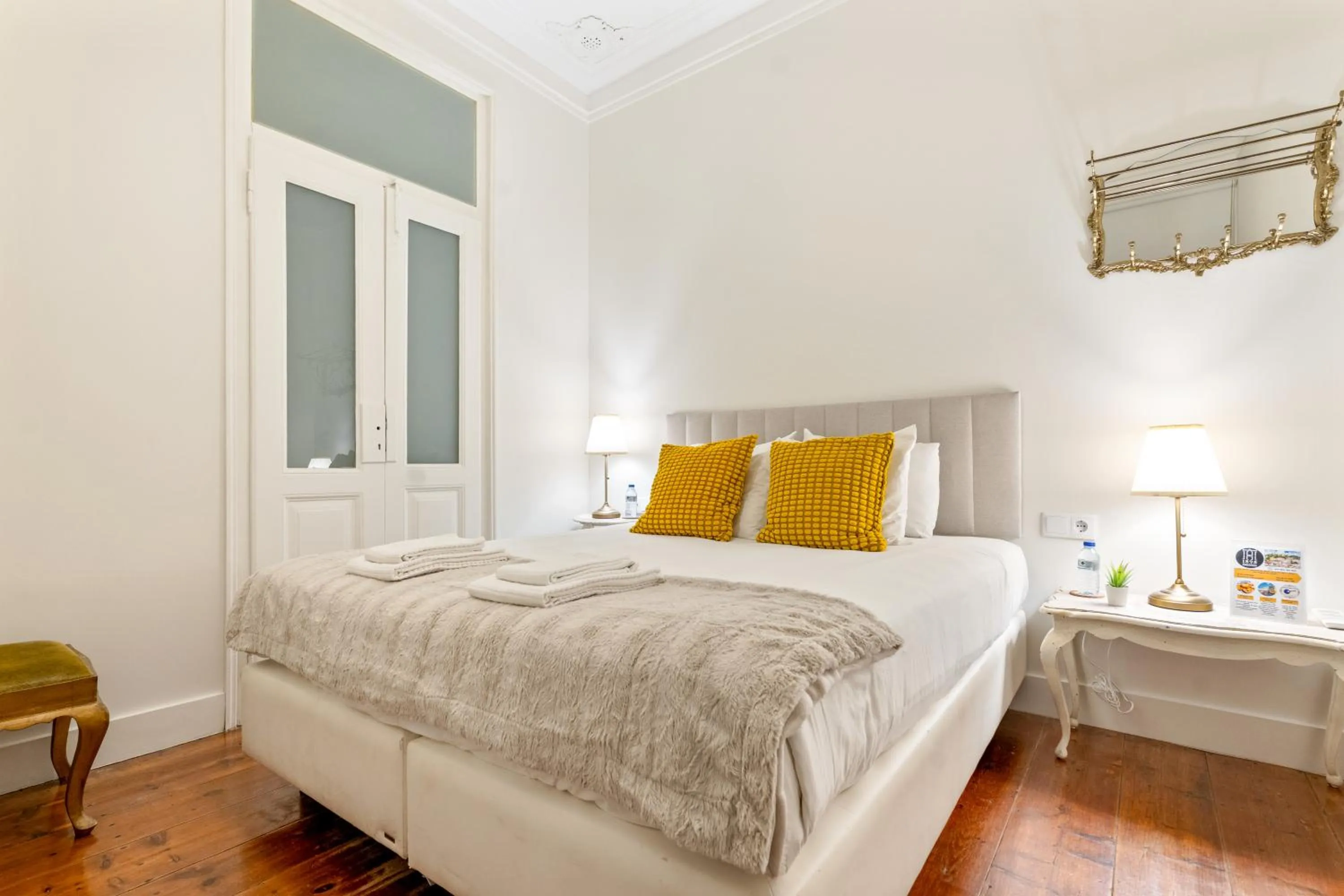 Bed in 1898 Home & Suites