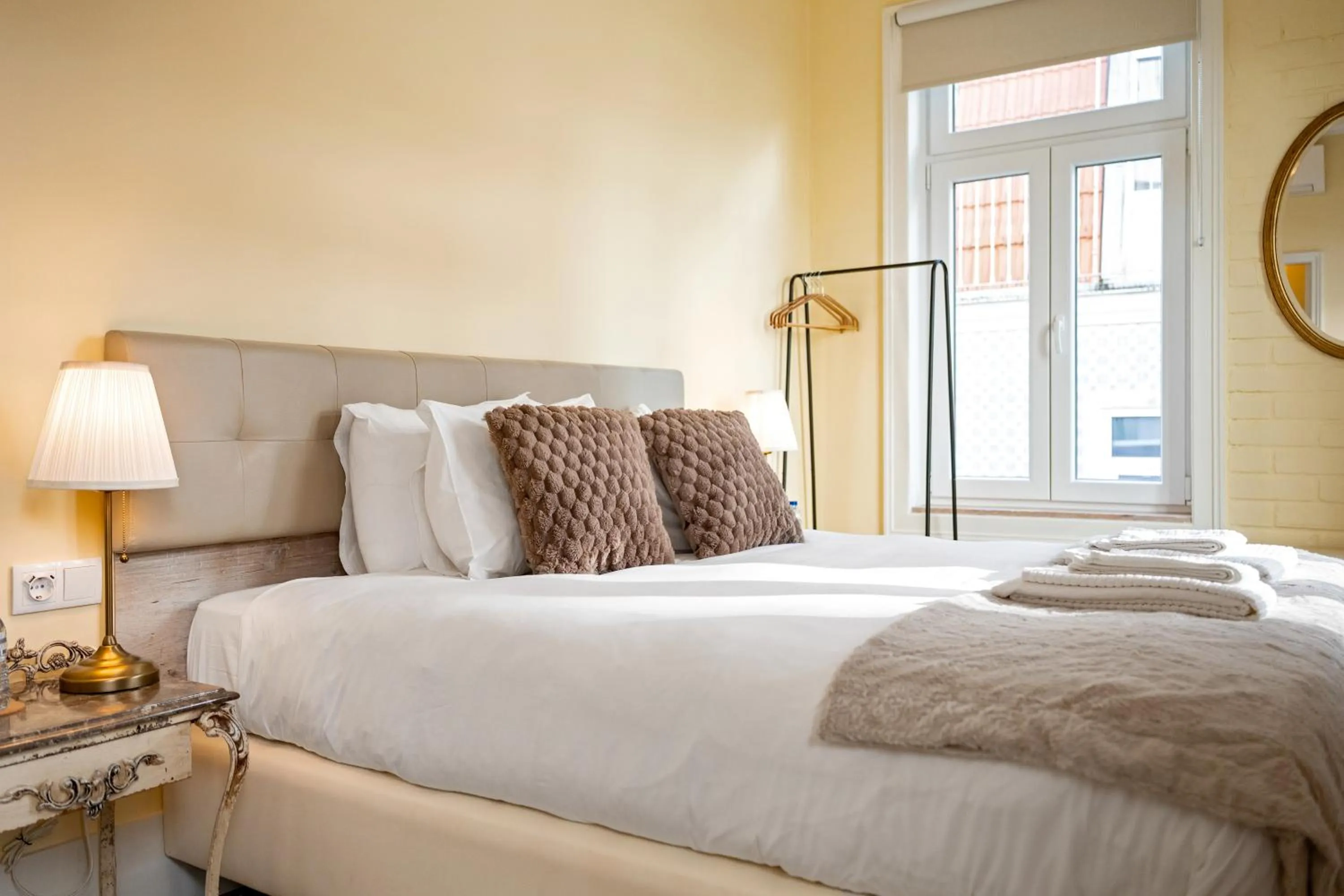 Bed in 1898 Home & Suites