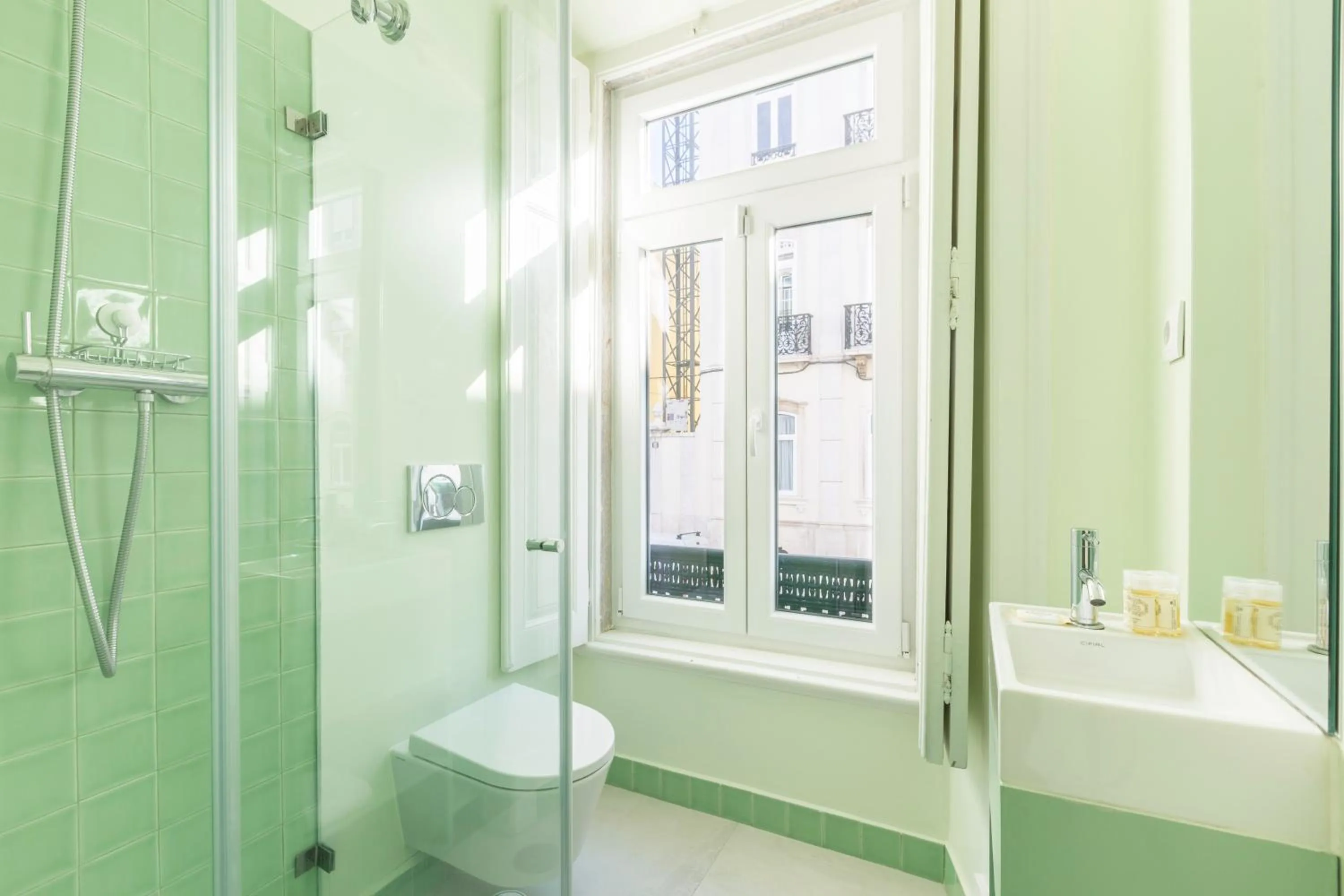 Toilet in 1898 Home & Suites