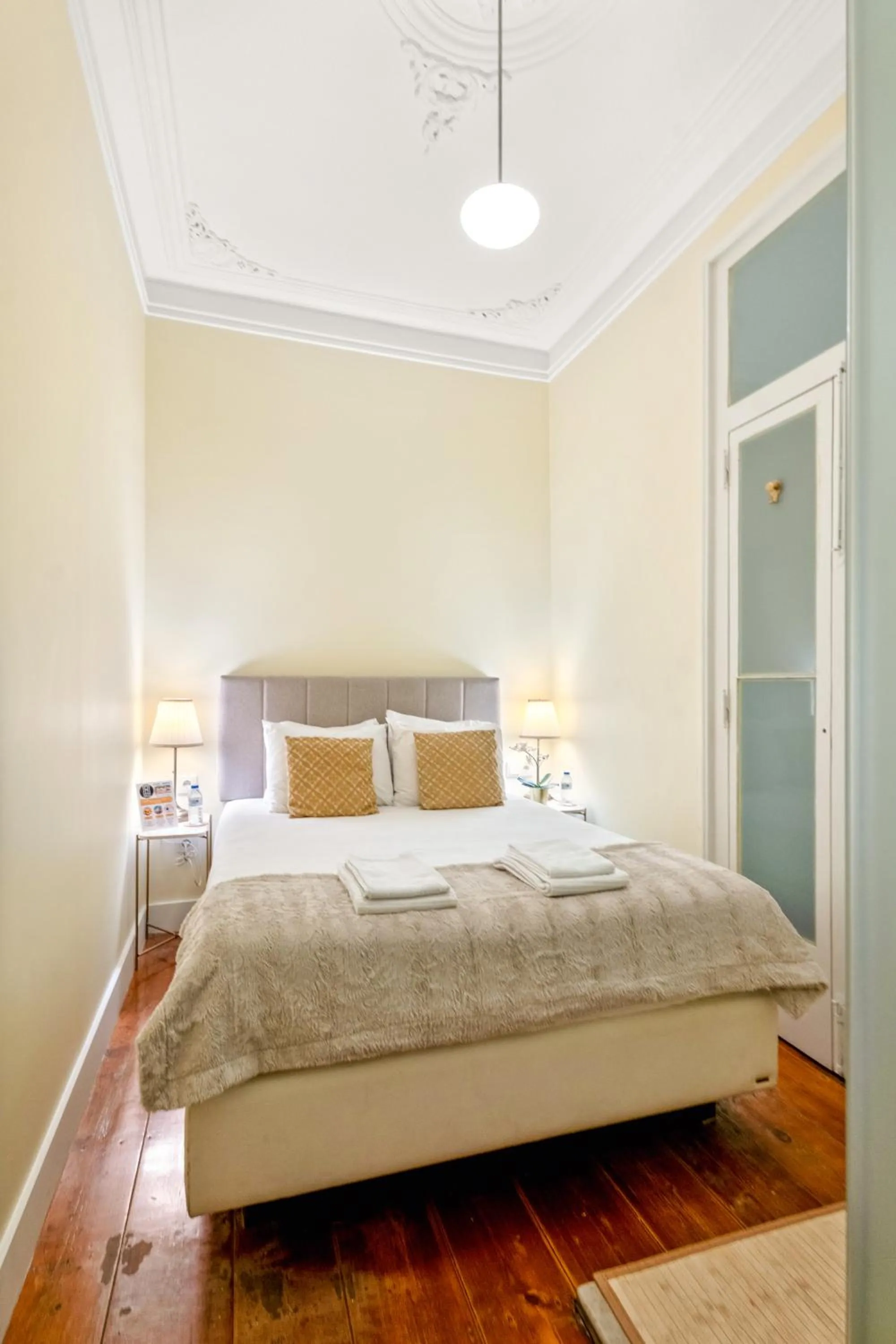 Bed in 1898 Home & Suites