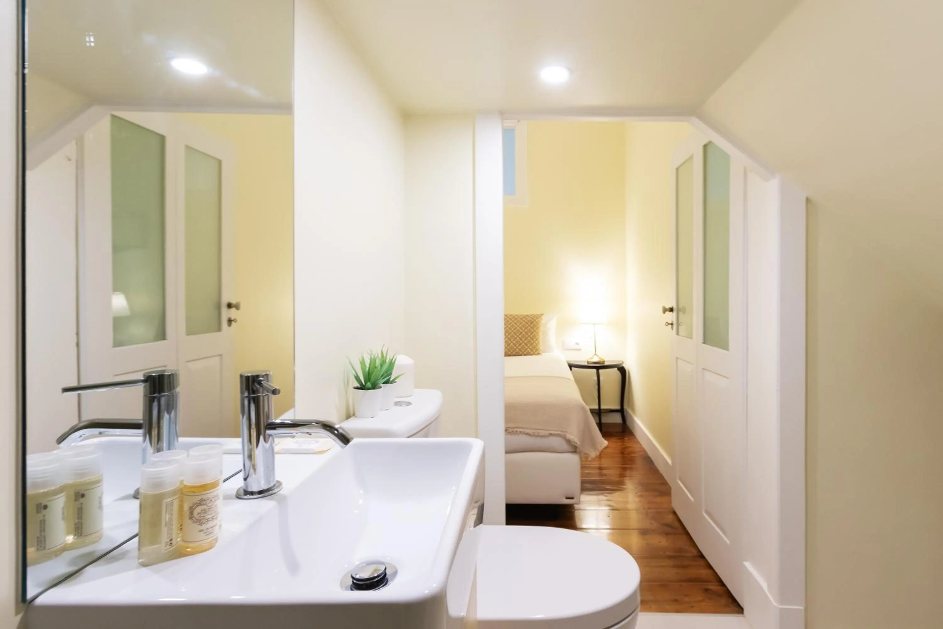 Toilet in 1898 Home & Suites