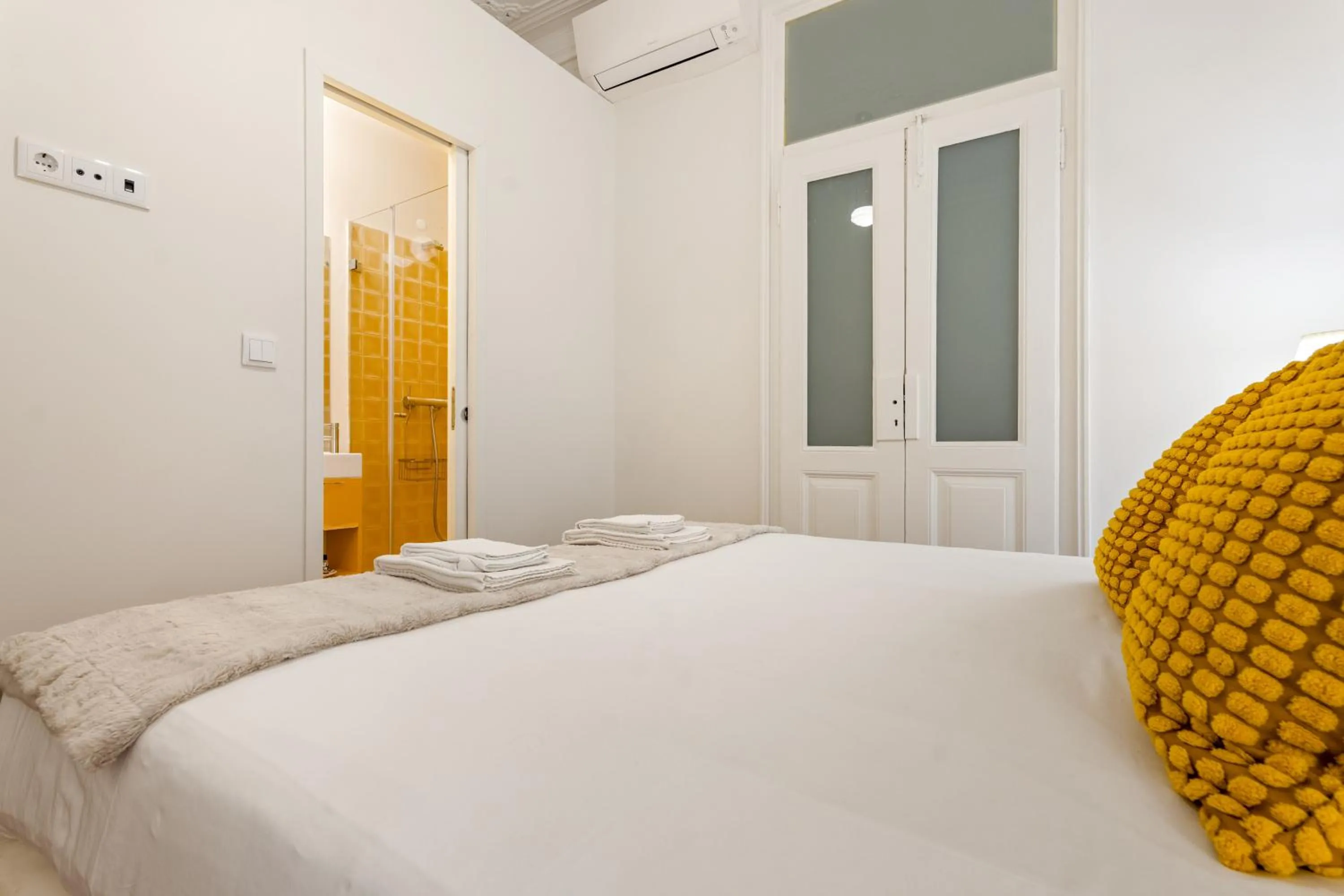 Bed in 1898 Home & Suites