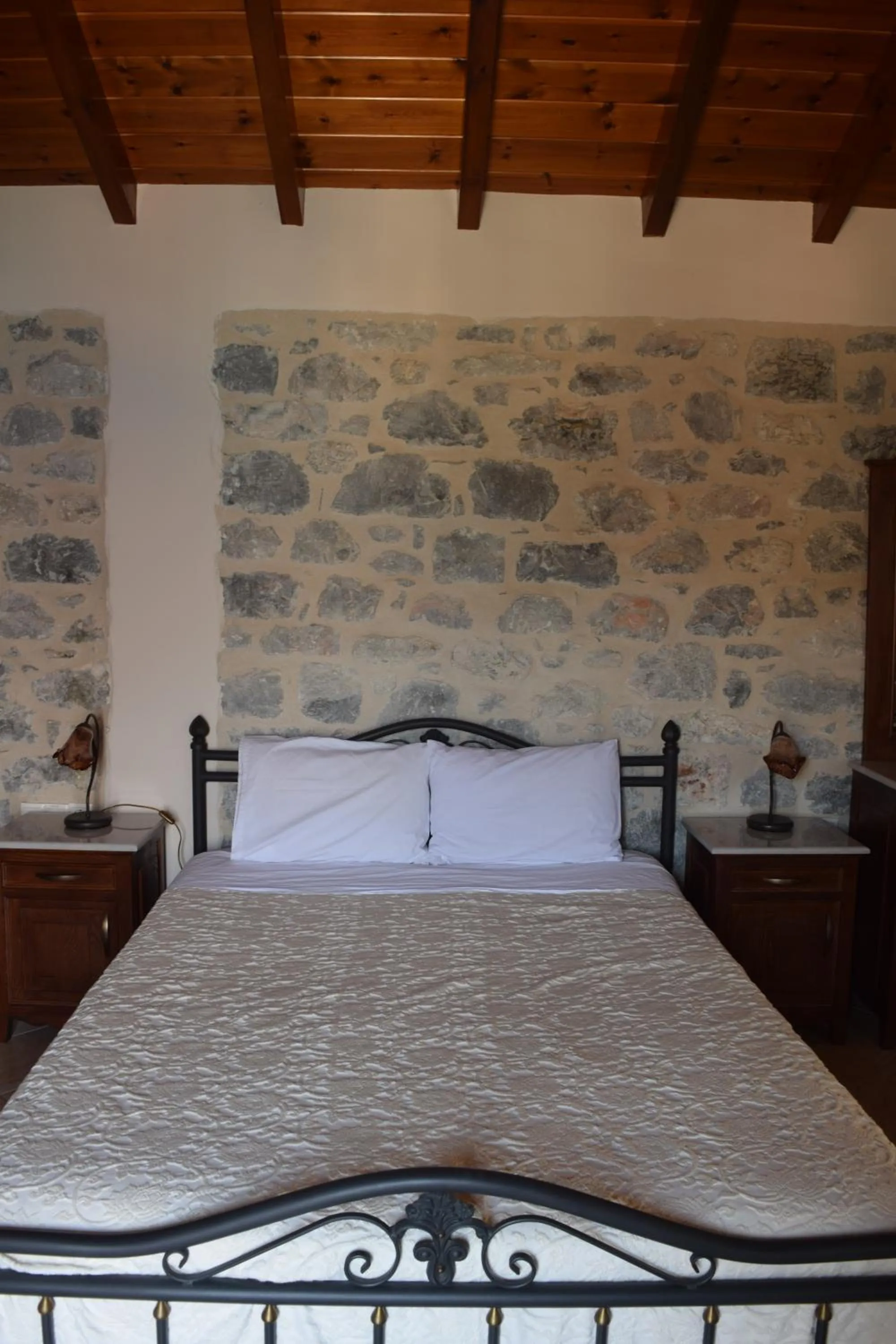 Bed in Vasilios Apartments Hotel