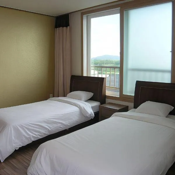 Bed in Jeju Ilsung Beach Condo