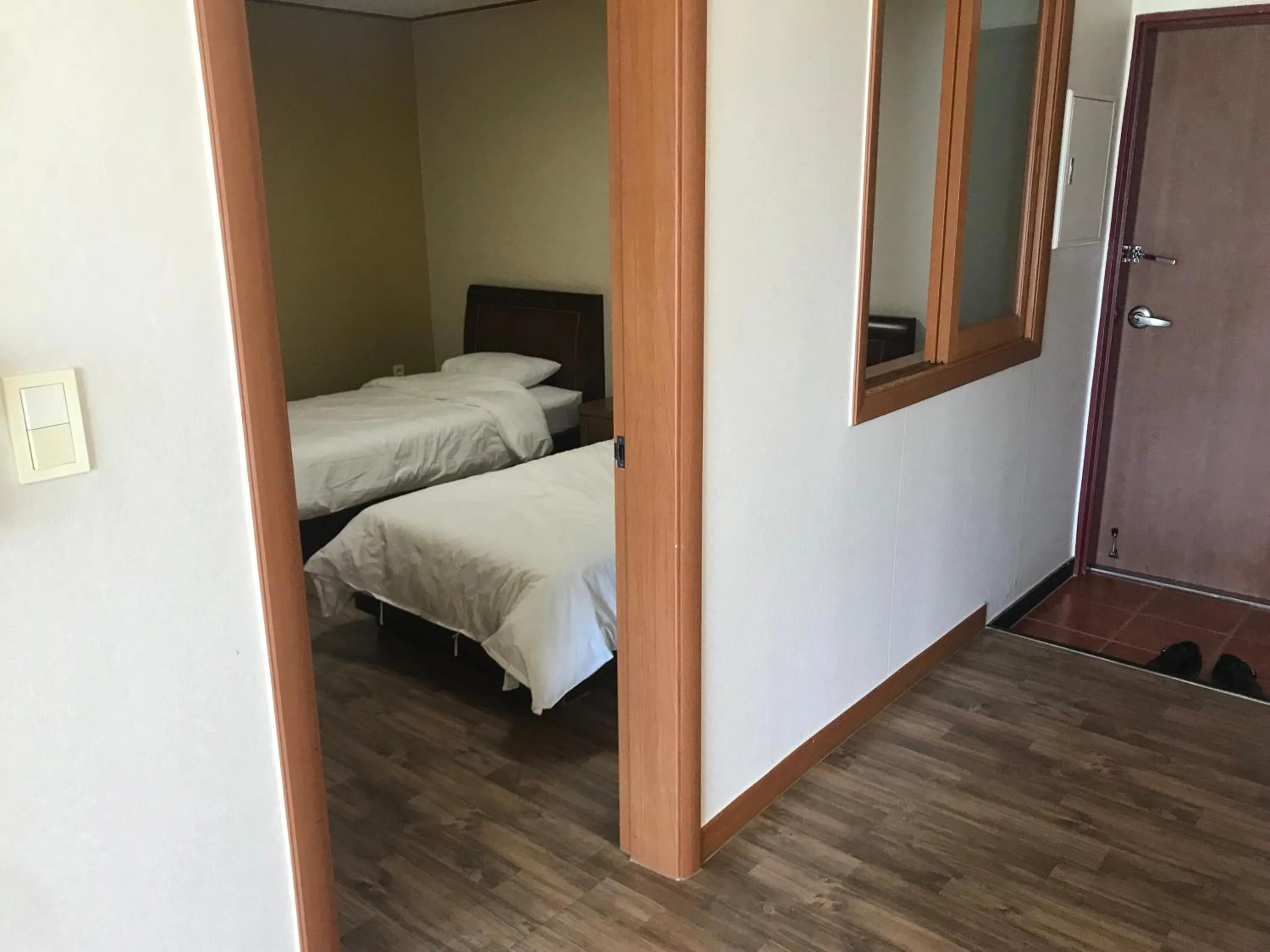 Bed in Jeju Ilsung Beach Condo